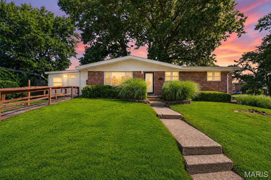 Welcome home to this beautifully updated brick ranch, where timeless charm meets modern convenience. Situated on a spacious, landscaped corner lot, this 3-bedroom, 1.5 bath home offers comfortable single-level living with stylish updates throughout. Step inside to a bright and inviting living room filled with natural light and warm wood flooring, creating the perfect space to relax or entertain. The updated kitchen features custom cabinetry, stainless steel appliances, generous counter space, and an effortless flow into the dining area, making everyday living both functional and inviting. Three generously sized bedrooms provide flexibility for family, guests, or a home office, while the updated full and half baths add convenience and modern appeal. The full unfinished basement offers incredible potential to create additional living space, a recreation room, home gym, or simply provides abundant storage. Outside, enjoy a large, private backyard with mature trees and plenty of room for entertaining, gardening, pets, or play. Additional highlights include a one-car tuck-under garage, no-step entry, and a convenient location. Combining thoughtful updates, a functional layout, and a generous lot, this move-in-ready home is an exceptional opportunity you won't want to miss.