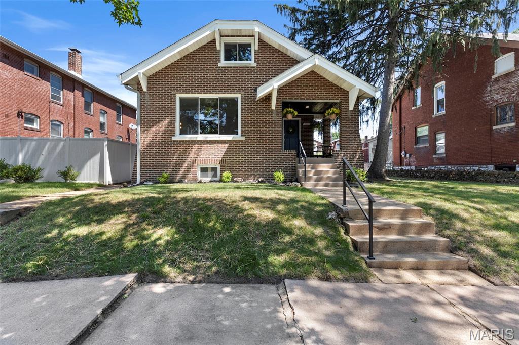 Fresh, stylish, and full of personality, this Southampton gem proves you don't have to choose between character and updates. Original refinished hardwood floors run throughout the living spaces and bedrooms, while the spacious living room is anchored by a large picture window that lets the sunshine pour in. Fresh paint, thoughtfully selected light fixtures, and on-trend design choices give the home an effortless, move-in-ready feel. The updated kitchen shines with granite countertops, a gorgeous tile backsplash, and beautiful finishes, while the bathroom steals the show with designer wallpaper that's equal parts bold and charming. Just off the kitchen, the sunporch is the perfect spot for morning coffee before heading out to the generously sized, fenced backyard complete with a parking pad. Upstairs, a bonus living area with abundant storage offers the flexibility for a home office, reading nook, playroom, or whatever life calls for next. The unfinished lower level is ready for storage, hobbies, a home gym, or your future vision. Aside from a picture-perfect home, your wallet will be happy since all the big items are taken care of: new roof, seeded yard, young HVAC, full house tuckpointing, and more! And the location? Just a stroll to all the Macklind favorites—Russell's, Clementine's, The Mack, Big River Running, and more—making it just as easy to grab an ice cream or dinner as it is to fall in love with the neighborhood.