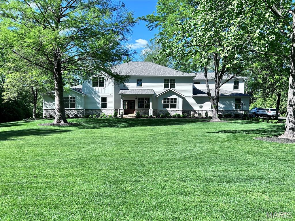 Ladue Schools! - Exceptional custom built new construction on a flat one-acre lot in Frontenac just down the road from Frontenac Mall. This stunning new construction residence with 9ft ceilings on both floors, offers over 6,200 sq/ft of refined living space (not including finished basement, 1,450 sq/ft) (6,236 +1,450 = 7,686 sq/ft of finished space per county records), thoughtfully designed for both everyday comfort and elevated entertaining. Situated on a beautifully landscaped, flat one-acre lot with convenient access to Highway 64/40 and I-270, this home seamlessly blends luxury, functionality, and location. Oversized, finished, 3-car garage with hook up for electric vehicle FAST charger. The home features five spacious bedrooms, five full baths, and one half bath, including two master suites - ideal for multi-generational living or flexible guest accommodations. First floor master bedroom with raised tray ceiling has two oversized closets with en-suite bath featuring shower and soaking tub. Second floor master is a generous bedroom en-suite with large walk in closet and master bath with shower and soaking tub. Custom millwork throughout showcases exceptional craftsmanship and attention to detail at every turn. True 3/4" hardwood white oak flooring for a long lasting solid feel throughout. At the heart of the home is a chef’s kitchen, anchored by a 48" dual-fuel range, premium appliances, and an oversized quartz island perfect for gatherings. Keep all of your clutter organized with a large mudroom with custom storage cubbies and extra coat closet. A luxury walk-in pantry (with large bonus storage room) provides abundant storage and organization, while the butlers pantry/bar with prep sink and wine fridge leads to an oversized formal dining room designed to host memorable dinners and celebrations. Oversized second floor laundry with utility sink, storage, folding station and built in drying racks will make laundry a dream! Second floor features 4 bedrooms plus an large bonus/second family room. The finished lower level is an entertainer’s dream, complete with a full kitchen and second dishwasher, perfect for events and extended stays. Wellness and recreation take center stage with a private sauna and dedicated workout room, bringing resort-style amenities home. A professional home office offers a quiet, sophisticated workspace, while the expansive outdoor living room with a wood-burning fireplace creates a year-round retreat overlooking the serene grounds. Enjoy both the comfort and high efficiency of having four zoned HVAC units, large, on-demand water heater with whole home ethernet wiring ready for a high speed, whole house mesh Wi-fi system. Every element of this home has been carefully curated to deliver timeless elegance, modern luxury, and exceptional livability—an extraordinary opportunity in a highly accessible location.