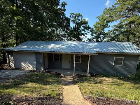 this 2 bed, 1 bath Lakefront home has been totally updated with all new flooring, newer windows and vinyl siding and would be a erfect summer home, weekender, or starter home.  there are 4 fishing lakes and beautiful beach with public pavilion.  Trolling motors are allowed.  A new line from home to septic , attached 1 car garage, 220V electric. New kitchen cabinets, updated bathroom and much more.  Summer is here so dont wait.