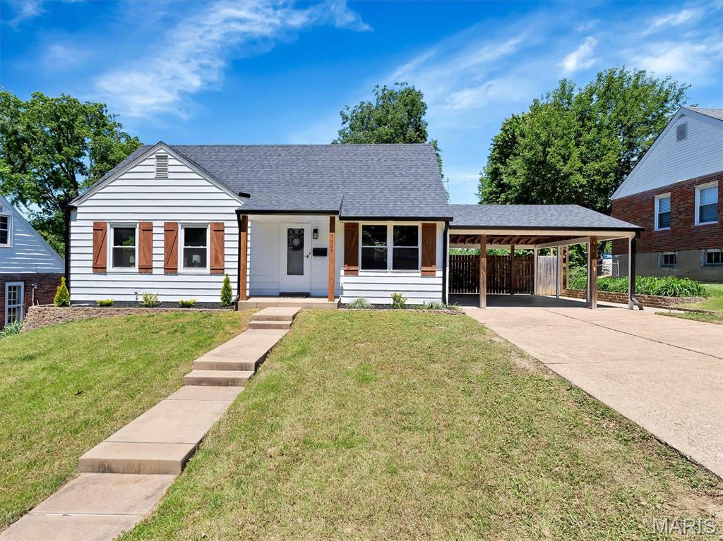 Welcome to 7065 Foxcroft Drive, a beautifully updated 1.5-story farmhouse in the desirable Mackenzie Hills subdivision of St. Louis. This charming 4-bedroom, 2-bath home boasts fresh landscaping and a welcoming curb appeal. Step inside to find a spacious main floor with two bedrooms and a full bath, plus a remodeled attic featuring two additional bedrooms and another full bath. The quaint kitchen is equipped with stainless steel appliances and a large island, both included, as well as built-in features. Entertain year-round on the covered deck, and enjoy the ease of a covered carport with an ample driveway. This home features a new roof and many more updates ensuring peace of mind. Located just minutes from Mackenzie Pointe shopping and Nine Mile Garden, this move-in ready home blends comfort and convenience—schedule your showing today!