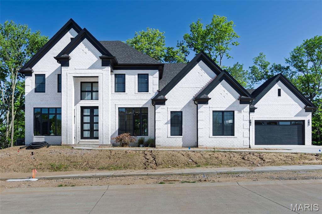 New Construction, Chesterfield, Rockwood Schools! MAGNIFICENT 1.5 Story home with Finished Lower Level in a FABULOUS LOCATION! Crafted by St. Louis' premier hands-on builder, Claymont Development, LLC - Wesley Byrne. The WINGATE III is a spectacular 5BR, 4.5bath with 5400 sqft of exquisitely finished living space. Exterior features a warm blend of brick & stone; extensive millwork; The two-story entry foyer makes a striking first impression! Formal dining room w/ wainscoting and den/ office on either side of the Foyer; two-story great room w/ gas fireplace, built-in shelving. Huge gourmet kitchen features custom cabs, granite counters & 9-ft island! Luxury owner’s suite with dual closets. Three bedrooms, two baths, and bonus room complete the upper level. 10' main floor ceiling, 8' doors, 4-car garage; Screened-in porch & deck overlooks common ground! Sensational LL includes brick/stone wet bar, huge rec-room, 5th bed, & full bath. Tour is of the Display Home.