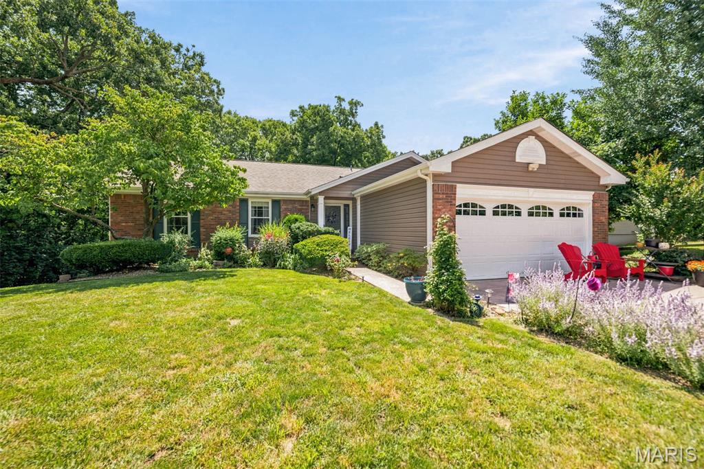 Wow! Honey, Stop the Car!
This stunning, lovingly maintained walk-out ranch is ready to welcome you home. Set on a beautifully landscaped lot in unincorporated St. Peters, it offers peaceful privacy while being conveniently close to Highway 70 for an easy commute.
Step inside the welcoming entry foyer and immediately feel the warmth and quality. With 4+ bedrooms and 3 full bathrooms, this home has been thoughtfully updated throughout. Recent upgrades include new vinyl siding, a composite deck, universal windows, all-new skylights, a new slider, garage door, HVAC system, updated bathrooms with granite countertops and new flooring, plus a refreshed driveway and porch, making this home truly move-in ready.
The dramatic vaulted, beamed ceilings grace both the spacious Great Room and Primary Bedroom, creating an open and airy feel. The heart of the home is the updated kitchen, featuring a large center island, granite countertops, an upgraded sink, and beautiful custom cabinetry. The adjacent Great Room boasts rich hardwood floors, a cozy fireplace (functional wood burning w/ an electric insert), and sliders that open to the composite deck overlooking a park-like backyard that backs to wooded common ground.
The Primary Suite is a true retreat with hardwood floors, a generous walk-in closet, and a luxurious full bathroom with a double vanity.
Downstairs, the fully finished walk-out basement offers incredible versatility with a kitchenette, additional bedroom, flexible sleeping area, and a large recreation/family room, perfect for entertaining, guests, or everyday living. Walk out through the sliders to the oversized concrete patio and enjoy one of the most serene backyard settings you’ll find — beautifully framed by mature perennials and exquisite landscaping.
Whether you’re relaxing after a long day or hosting friends and family, this backyard oasis is more than adequate for any occasion.
Don’t miss your opportunity to own this move-in ready gem!