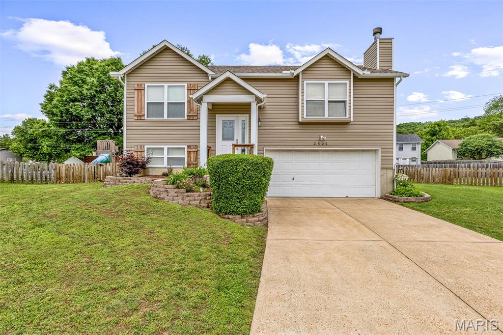 Located on a quiet cul-de-sac in Imperial and within the sought-after Seckman School District, this 3-bedroom, 2 full bath split foyer home offers space, updates, and flexibility! The main level features two generously sized bedrooms and an updated full bath. The oversized lower-level bedroom includes two egress windows, offering the potential to easily divide the space into two separate rooms, a home office, or additional living area.
The finished lower level also includes a second full bath, laundry area, and access to the oversized 2-car garage with plenty of extra storage space. Major updates provide peace of mind, including vinyl siding, roof, gutters, and downspouts (2025), garage door opener (2025), furnace (2023), and updated smoke alarms with carbon monoxide monitors throughout. Enjoy the level fully fenced back yard and fantastic neighbors! Conveniently located near shopping, dining, local parks and major highways!