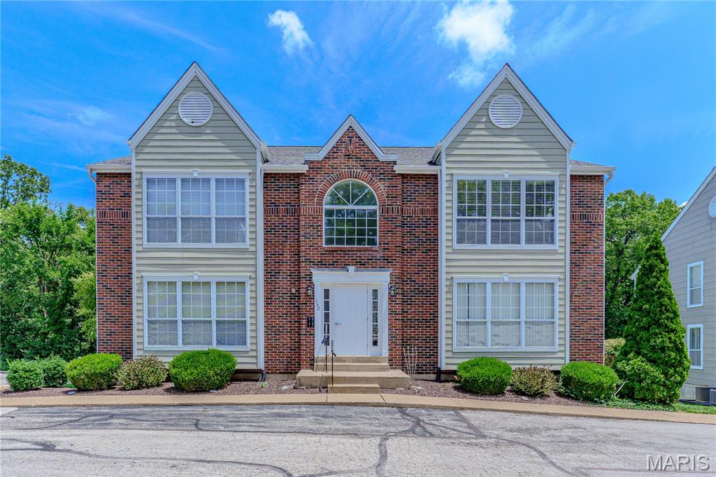 Welcome to 1332 Highland Oaks Drive Unit D, a beautifully updated 2 BR/2BA second-floor condo offering an open, light-filled floor plan with soaring vaulted ceilings, spacious layout and gorgeous laminate floors offering the warmth and beauty of hardwoods without showing wear and tear. Impressive kitchen features white cabinetry, granite counters, stainless steel appliances, generous pantry, breakfast bar and glass tile backsplash. Kitchen and bathrooms all have ceramic tile flooring. The primary bedroom features walk in closet, private bath with double sinks and oversized shower, plus access to deck overlooking private treed view. A convenient in-unit laundry with full-size washer and dryer that remain for the next owner.  Additional highlights include an assigned garage parking space, private storage area, and abundant guest parking for family and friends. Home has been lovingly maintained and passed the St. Louis County occupancy inspection with flying colors. With access to subdivision from Big Bend or Hanna Rd, it’s easy to access all the shopping, restaurants and parks Ballwin has to offer. Close to Hwy 141, Manchester Rd, I-44 and I-270 it’s an easy commute anywhere in the St. Louis area. This move-in ready condo combines low-maintenance living and fantastic location, the perfect place to call home!
