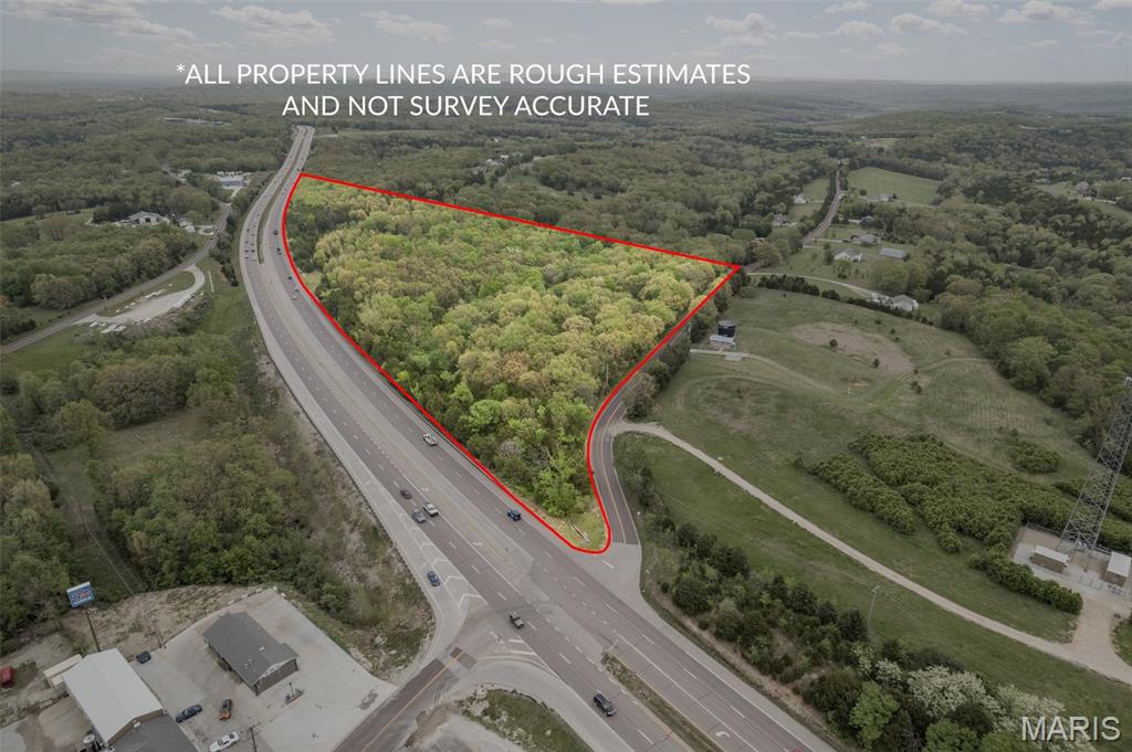 27 Acres of Commercial/Residential property for sale with approximately half mile of Highway 67 frontage. Approximately a quarter mile of Flucom Road frontage. Seller is willing to divide. 21 acres are zoned commercial, and 6 acres are zoned residential. Endless potential with this 21-acre commercial property along with 6 acres of residential. Live and work in one place! Property has lots of marketable timber. Residential side has cleared area ready to build. It has an entry gate for security. Driveway is in place and a bridge with culverts installed. Great for hunting and it has a country feel with access to town within a few miles. This land could be used for multiple purposes subject to county approval. Location: Corner Location, Hwy/Interstate Frontage