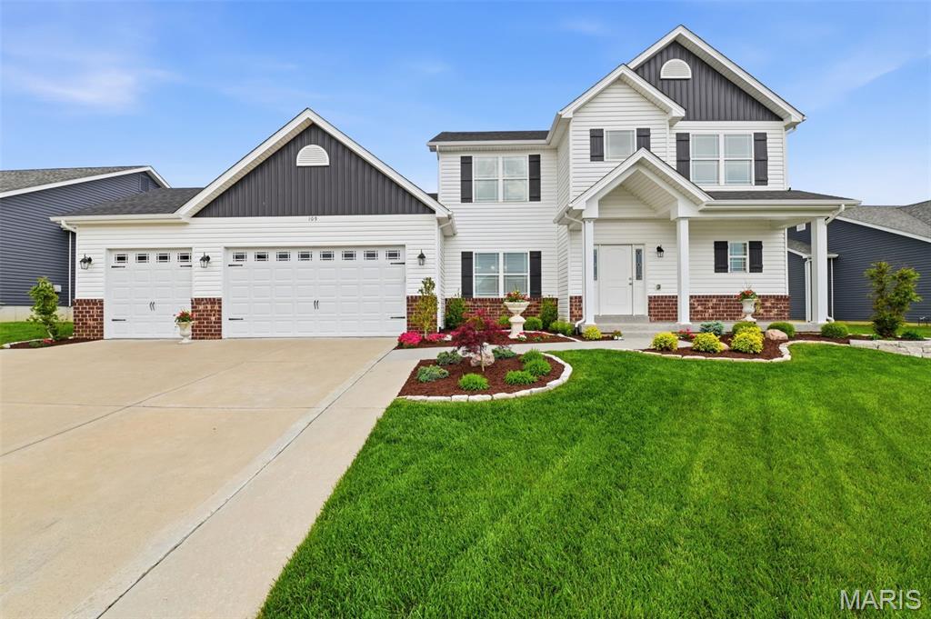 Still like new, but without the build time — or the premium cost! This immaculately kept, 5-years-young home has over 3,600 sq ft of finished living space with 5 bedrooms, 4.5 baths, and a spacious 3-car garage! We're not saying it's the nicest home on the market in Wentzville right now... but we are saying you should probably make this the first stop on your list. Welcome to 109 Pomodora Circle, where thoughtful design meets effortless everyday luxury in the sought-after Hampton Grove community.

From the moment you step inside, you’re greeted by a light-filled two-story great room anchored by a stunning stone fireplace and a wall of windows that creates an inviting, elevated living space. The open-concept layout flows seamlessly into the kitchen and breakfast area—perfect for hosting gatherings or enjoying relaxed mornings at home. The kitchen is designed to impress with granite countertops, a large center island, walk-in pantry, and ample cabinetry for both function and style.

The main-level primary suite offers a private retreat, complete with a spa-like bath featuring a soaking tub, tiled walk-in shower, double vanity, and generous walk-in closet. Upstairs, a versatile loft overlooks the great room and leads to three spacious bedrooms, including a private ensuite and a shared Jack-and-Jill style bath—ideal for family or guests.

The finished lower level expands your living space with a large recreation area, additional bedroom with egress window, full bath, and abundant storage—perfect for movie nights, fitness, or a guest suite.

Step outside to a fully fenced, private backyard designed for both play and relaxation, complete with an in-ground sprinkler system. The oversized 3-car garage features tall doors for added convenience, while the epoxy-finished front porch and walkway add a polished, upscale touch.

Located near top-rated Wentzville schools and newer community amenities, this home offers the perfect blend of comfort, style, and functionality in a growing, highly desirable area