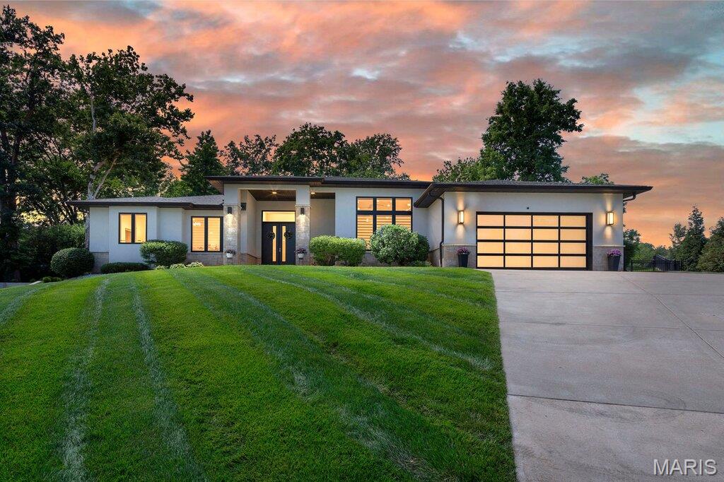 This well-maintained, modern home (8 years old) offers comfortable living with ceramic tile flooring throughout the entire main level. The spacious family room flows seamlessly into the kitchen and dining area, creating an open-concept layout perfect for everyday living and entertaining. Step directly from the family room onto the covered back patio, ideal for relaxing or hosting guests. The main floor features a desirable split-bedroom design with two bedrooms. The primary suite includes a walk-in closet and a private full bath with both a soaking tub and separate shower. A second bedroom and full bathroom are located on the opposite side of the home, providing added privacy. You'll also find a welcoming living room and convenient main-floor laundry. The finished basement expands the living space with two additional bedrooms, a full bathroom, a large, finished recreation area, and abundant storage space. Outside, enjoy a private, fenced backyard that is perfect for entertaining, pets, or family activities. Conveniently located near shopping, dining, and everyday amenities, this home combines space, comfort, and an excellent location.