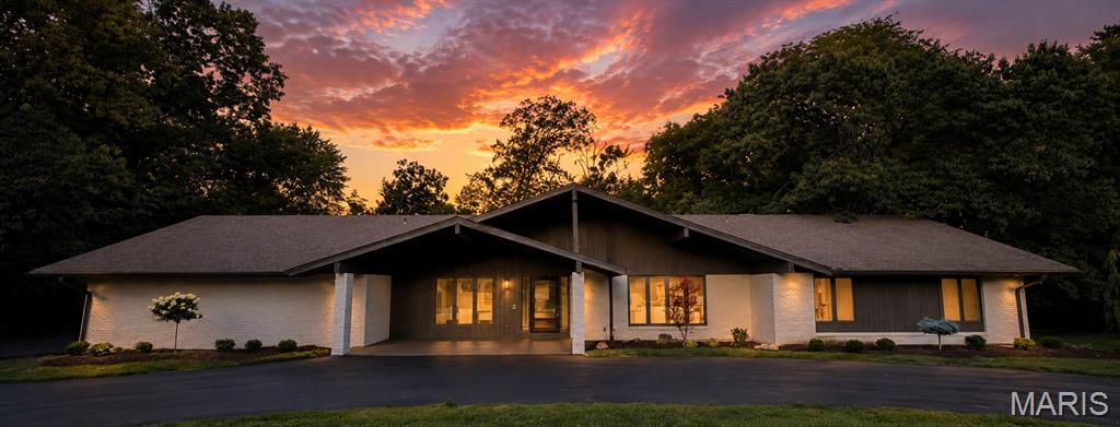 Welcome to this stunning, fully remodeled ranch home  with a huge 4 car garage nestled in the highly sought-after Meadowbrook Country Club community. Offering 5 spacious bedrooms and 3.5 beautifully updated bathrooms, this exceptional home blends timeless style with modern luxury. The open and inviting floor plan showcases vaulted ceilings, original millwork, an updated kitchen with quartz tops, stainless appliance, 36" gas range, designer fixtures, and thoughtfully renovated living spaces throughout. The finished lower level provides 2 bedrooms, spacious walk-in closets,  room to entertain, relax, or accommodate guests with flexible living space and ample storage. Whether you're hosting gatherings or enjoying quiet evenings at home, this move-in-ready property offers comfort, sophistication, and effortless living in one of the areas most desirable neighborhoods.  Seller recently updated both HVAC systems and had a new driveway installed!!