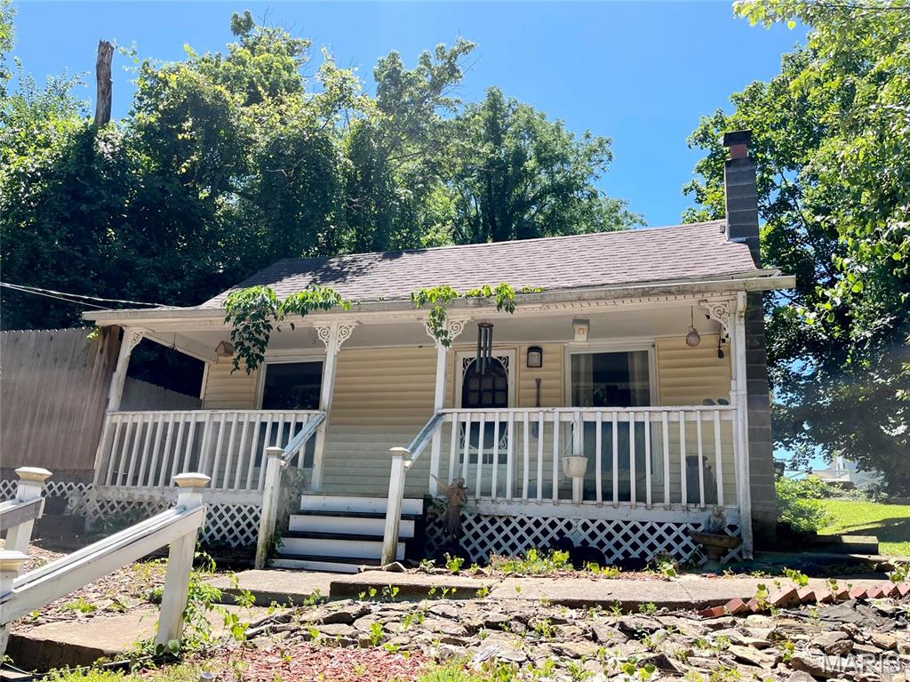 Improvements include a 3 bedroom +bonus room, 2 bath, living room, kitchen w/appliances, family room w/free standing wood heating stove, main floor laundry, washer & dryer stay with home.  Other improvements include a 30'x32' metal shop w/concrete floor & overhead door, big corner lot w/lots of trees & foliage for privacy. Updates include new FA natural gas furnace w/air in August of 2024, gas water heater in 2019 and a new roof in 2018. The home is on city water & sewer w/natural gas.  The home will sell absolute at public auction on Saturday August 8, 2026.