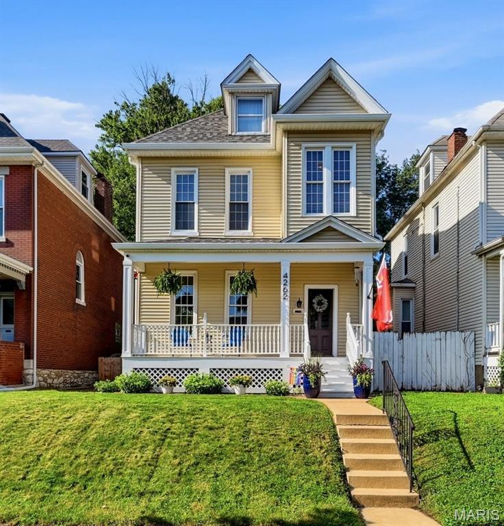 Welcome to 4262 Hartford Street, where timeless character and thoughtful updates come together in one of South St. Louis' most desirable neighborhoods. Just moments from Tower Grove Park, this beautifully maintained historic home offers the perfect blend of original craftsmanship and modern comfort.

From the moment you arrive, the expansive covered front porch invites you to slow down and enjoy everything this charming neighborhood has to offer. Whether you're sipping your morning coffee, visiting with neighbors, or unwinding after a long day, this welcoming space sets the tone for the warmth you'll find throughout the home.

Step inside to discover rich hardwood flooring, stunning millwork, fresh paint throughout, and the character that makes historic homes so special. The spacious family room flows seamlessly into the formal dining room, creating the perfect setting for everyday living and memorable gatherings with family and friends.

The kitchen offers both functionality and charm, while the adjoining mudroom provides convenient access to the back deck—making indoor and outdoor entertaining effortless. Beyond the deck, the fully fenced backyard provides plenty of space for pets, play, gardening, or simply enjoying a private outdoor retreat. A convenient half bathroom completes the main level.

Upstairs, you'll find two generously sized bedrooms, a dedicated home office, and a beautifully renovated full bathroom featuring stylish, modern finishes that complement the home's historic appeal. The third floor offers a spacious third bedroom that provides endless flexibility as a private primary retreat, guest suite, bonus living space, or creative studio.

Located just minutes from the walking trails, farmers market, restaurants, and year-round events that make the Tower Grove neighborhood so beloved, this home offers the opportunity to enjoy one of St. Louis' most vibrant lifestyles. If you've been searching for historic charm, thoughtful updates, inviting outdoor spaces, and an unbeatable location, 4262 Hartford Street is ready to welcome you home.