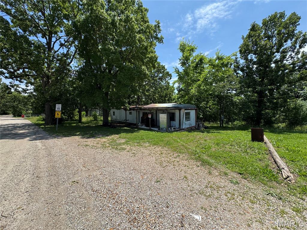 Opportunity awaits with this versatile 0.31 +/- acre residential lot featuring public water, public sewer, and electric already on the property. Mobile homes are permitted, making this an excellent option for mobile home placement or future homesite. An existing mobile home is located on the property and is being conveyed with no assigned value. Buyers & buyers agents are encouraged to perform their own due diligence regarding the condition and suitability of all improvements, utilities, zoning, lot boundaries & subdivision restrictions if any. Conveniently located in between St. Robert & Dixon Missouri and ready for your vision to take shape.