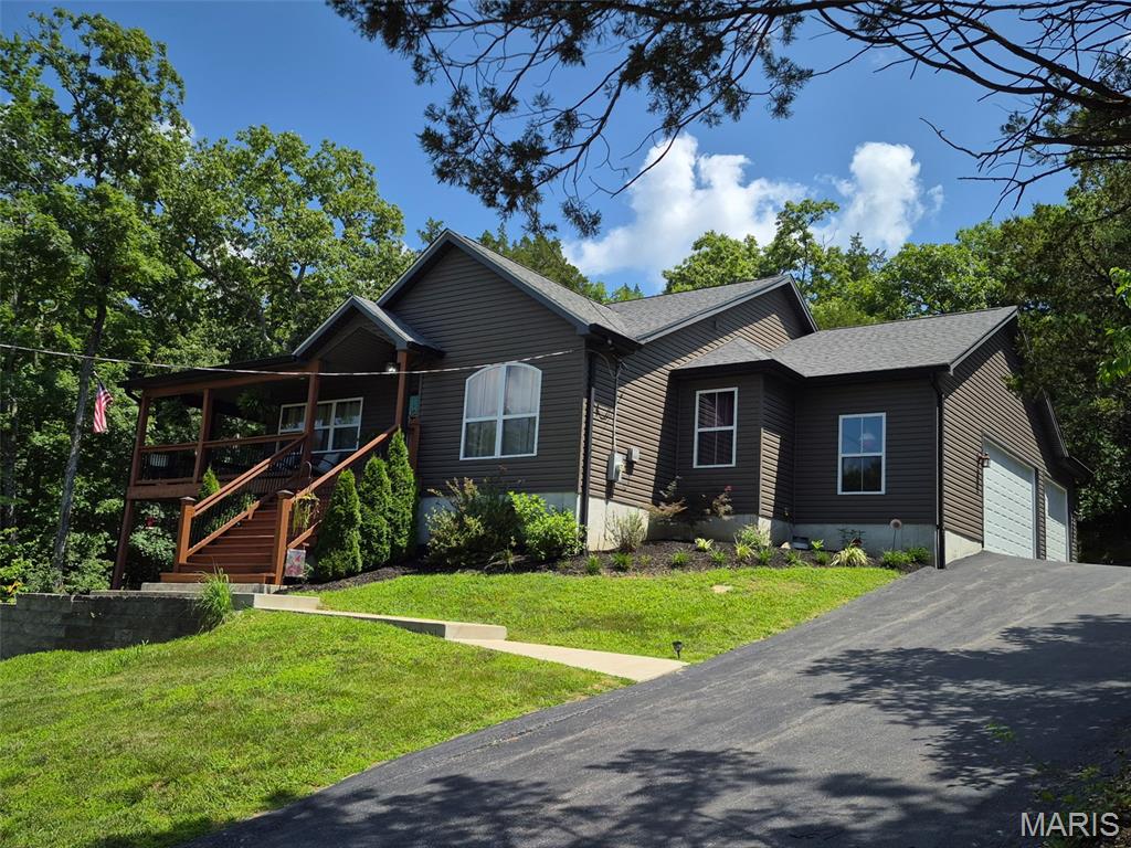 Imagine ending your day with peaceful lake views from your wraparound porch, weekends spent out on the water, and the quiet perks of life in a private lake community. Welcome home to Lake Montowese.
Built in 2018 and beautifully maintained, this Ranch offers 3 bedrooms, 3 baths, an attached 3-car garage, and a finished walk-out lower level made for gathering. Inside, the open main living space centers around a cozy propane fireplace, with large windows that pull the outdoors in and main-floor laundry for easy everyday living. Downstairs, a spacious family room with a kitchenette, full bath, and abundant storage sets the stage for hosting guests, game nights, or just the ultimate hangout space.
Outside, the gently sloping lot and wraparound porch practically ask you to slow down — morning coffee, evening sunsets, the sound of the lake just beyond the trees.
And life here extends well beyond your front door. Residents enjoy their own private lake with a boat dock, a residents-only beach, tennis courts, parks, boat storage, and community traditions like the annual fireworks over the lake. The home itself is all-electric with public water and sewer, plus propane service for the fireplace and range. Even better? The pontoon boat is included with the sale! With approximately 25 feet of seawall available for docking, you'll be ready to enjoy lake life from day one. 
Some homes check the boxes. This one offers the kind of lifestyle people dream about.