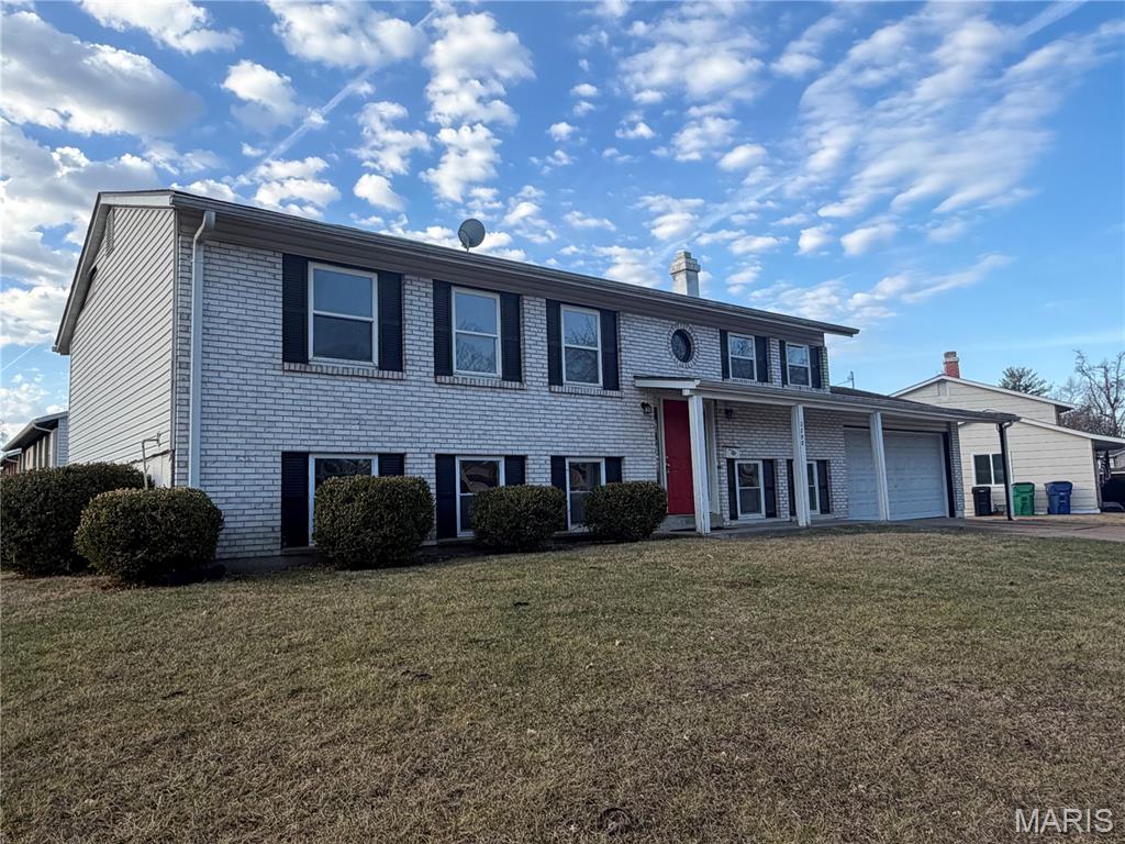 Beautiful 5-bedroom, 2-bath split-level home situated on a spacious corner lot with a fenced backyard. The exterior features vinyl siding, an architectural shingle roof, and energy-efficient windows.The upper level offers hardwood floors extending through the living areas, dining room, and upstairs bedrooms. The kitchen includes granite countertops, stainless steel appliances, and an open-concept layout ideal for entertaining.

Both bathrooms have onyx tops and modern tile finishes. The lower level includes new carpet in the bedrooms and new luxury vinyl plank, a cozy wood-burning fireplace, and a walk-out sliding glass door leading to the backyard.

Property is being sold as-is. Seller will make no repairs or provide warranties. Any inspections conducted are for informational purposes only. The owner is a licensed realtor in the state of Missouri.