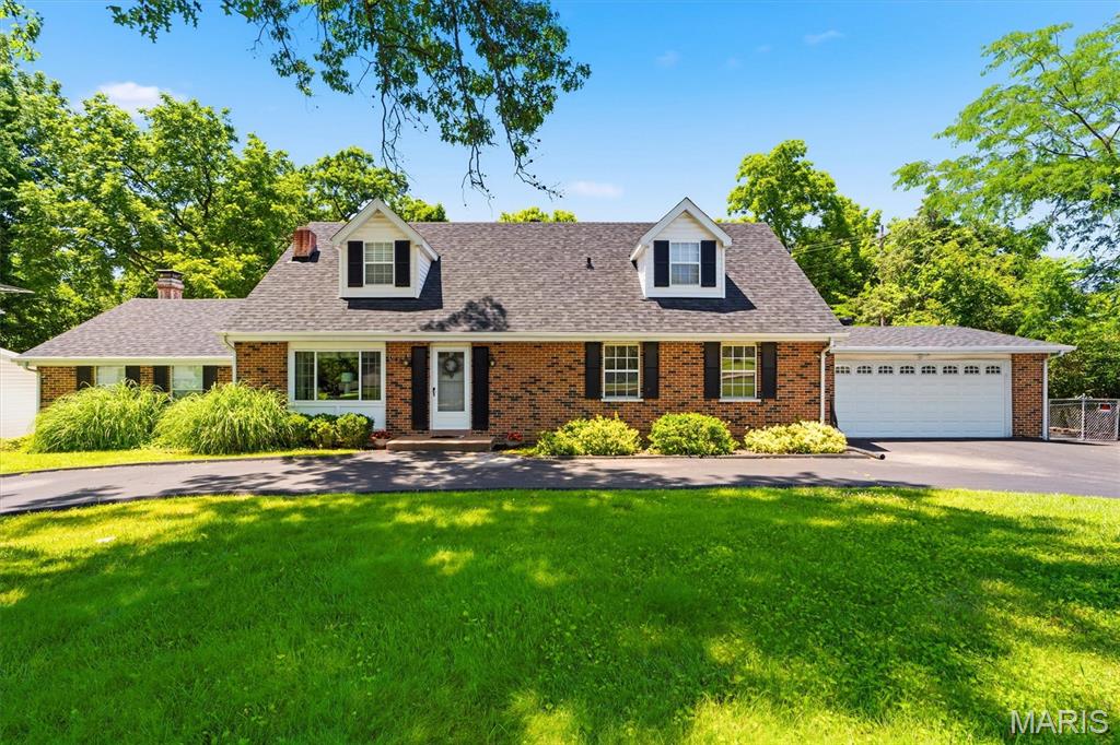 Welcome home to this beautiful 1.5-story home in the desirable Fernwood subdivision! Offering 5 bedrooms and 3 full baths, this home features a sought-after main-floor primary suite and a walk-out lower level. The sunken living room boasts a cozy fireplace, creating the perfect gathering space during the cooler months. Step outside and enjoy your own backyard retreat with a stunning deck, patio, and swimming pool—ideal for summer entertaining and relaxation. Surrounded by mature trees and friendly neighbors, this home offers both privacy and community. Additional highlights include a new roof installed in April 2026, HVAC new in 2024, convenient access to public transportation, nearby restaurants, and location within the highly regarded Parkway North School District, including sought-after Bellerive Elementary School. Don't miss this wonderful opportunity to make 1143 Fernview Drive your new home!