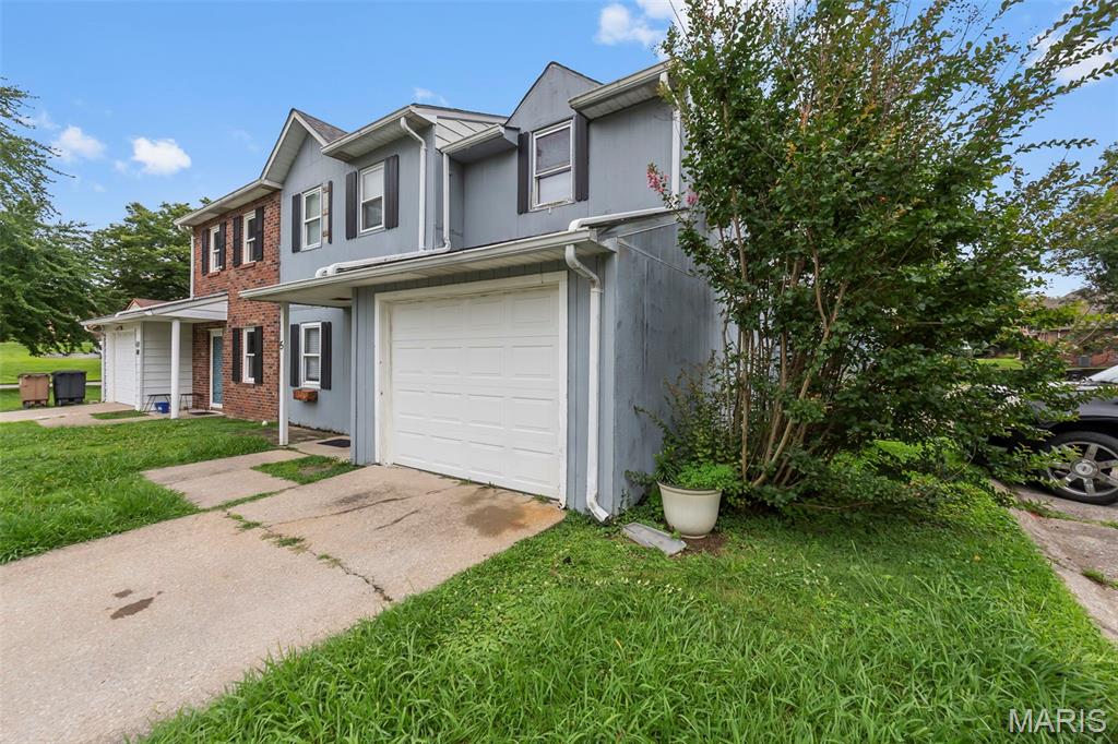 Affordable Living or Great Investment Opportunity! This charming townhouse at 1602 Amblewood Dr. Apt. 5 offers 3 bedrooms, 1 full bath, and 1 half bath with updates already taken care of. Step inside and appreciate the original hardwood floors and fresh paint throughout. The main level features a spacious living room, kitchen, convenient laundry hookups, and a half bath, while the upper level includes all three bedrooms and a full bathroom. Enjoy peace of mind with a roof that is 3 years old and HVAC system that's only a 1 years old. The property also includes a single-car garage plus an additional parking space. Whether you're searching for an affordable place to call home or looking to add a solid property to your rental portfolio, this townhouse checks all the boxes. Don't miss this opportunity—schedule your showing today!