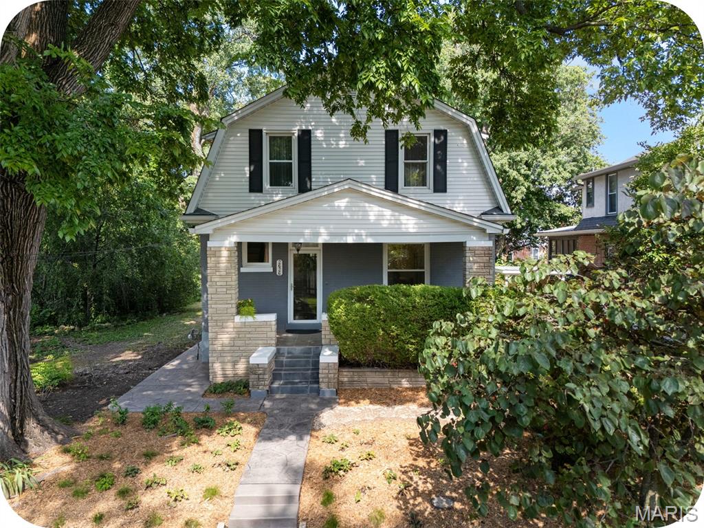 **Open House Sunday 1-3p** Welcome to 2626 Margarette Ave—a spacious Dutch Colonial full of character, tucked on a quiet street just steps from Maplewood’s beloved shops and restaurants. From the moment you enter, the home’s scale and natural light make an impression. The foyer and staircase set the tone, leading into a warm and inviting living room featuring hardwood floors, a large picturesque window and a beautiful arched entryway into the dining room. The dining space offers generous room for gathering and flows seamlessly into the true showstopper—the kitchen. Thoughtfully refreshed, it features modern soft-close cabinetry, quartz countertops, updated lighting, and a built-in wine rack, all while preserving the original pantry—blending timeless charm with everyday functionality.

Upstairs, both bedrooms offer impressive space, easily accommodating king-sized beds along with additional furniture or storage. The primary bedroom overlooks the front yard’s blooming landscape, while the second bedroom enjoys views of the backyard garden and sits just steps from the bathroom. Sconces in each room add warmth and character. The bathroom has been tastefully updated with a freshly glazed tub, new vanity, and classic beadboard detailing. Throughout the home, you’ll find fresh interior paint, updated windows, new water heater and a bright, welcoming layout that feels both comfortable and refined. Step outside and the charm continues. A covered front porch sets the scene—perfect for a pair of rocking chairs and a glass of iced tea—while a second covered porch in the back gives you a front-row seat to your backyard (and the chickens). A new stamped concrete walkway creates a warm welcome, complemented by a thoughtfully designed native plant garden in the front yard. Out back, the space truly shines with raised garden beds and a chicken coop—ideal for anyone dreaming of a more sustainable lifestyle. A driveway + carport adds convenient off-street parking for at least 3 vehicles.  Headed to Maplewood’s “Let Them Eat Art” festival this weekend? Take a stroll down Margarette for a sneak peek. Join us for an open house this Sunday from 1–3 PM, or schedule a private tour with your favorite Realtor this weekend to experience all that Margarette has to offer.