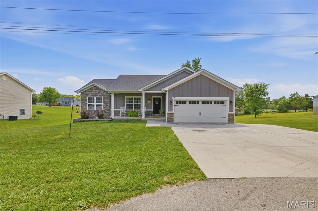 Charming 2020-Built Home on a Quiet, Private Lot in Potosi!
Nestled in a peaceful neighborhood outside city limits, this stunning 4-bedroom, 3-bathroom home sits perfectly at the end of a quiet dead-end road, offering both privacy and the convenience of city utilities.
Step inside to a bright, open-concept floor plan boasting vaulted ceilings and a gorgeous kitchen complete with sleek quartz countertops—perfect for entertaining. The main level conveniently features 3 bedrooms, 2 bathrooms, and main floor laundry. Just off the dining area, a covered deck awaits your morning coffee or evening relaxation.
The full walkout basement is incredibly spacious, offering a massive family room, a 4th bedroom, and a full bathroom with a custom walk-in shower. For peace of mind, a concrete safe room is located directly under the front porch. Outside the basement door, a concrete patio overlooks the beautifully level backyard.
Complete with an attached 2-car garage, durable LP SmartSide wood siding, and elegant stone accents on the front, this move-in-ready home truly has it all. Schedule your showing today!
