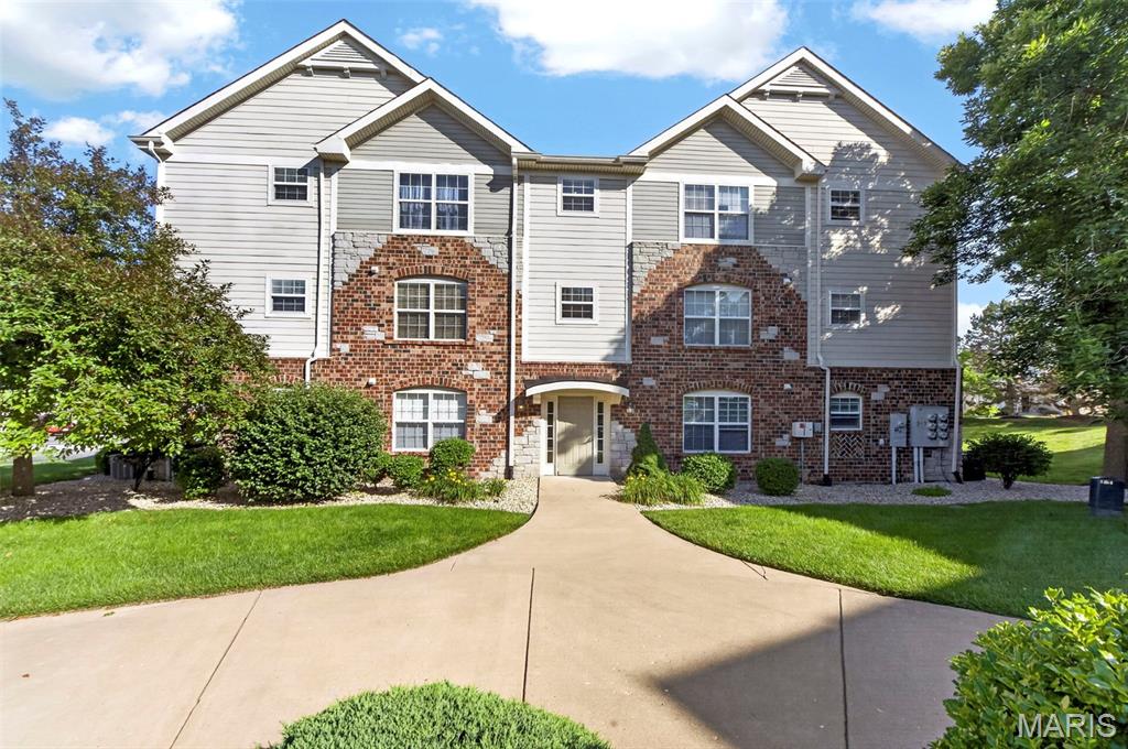 Location, Location, Location! Conveniently located just off Highway 364 in St. Peters, just minutes from Historic Cottleville, this move-in-ready condo offers maintenance-free living at its finest. Situated in one of only two buildings in the community with secure entry doors and an intercom system, this desirable building also features elevator access for added convenience.

Step inside to an inviting open floor plan featuring a spacious living room that flows seamlessly into the eat-in kitchen. The kitchen is equipped with 42-inch cabinets, a pantry, smooth-top electric range, and ample storage and workspace.

The generously sized primary suite is sure to impress with abundant natural light, a walk-in closet, and a private ensuite bath. The second bedroom is also nicely sized and thoughtfully located on the opposite side of the unit for added privacy. A second full bathroom with a tub, convenient in-unit laundry, and a private balcony with a storage closet complete the interior.

Additional highlights include TWO covered parking spaces, a rare amenity that adds convenience and protection from the elements.

The monthly condo fee covers many essentials, allowing you to enjoy a truly low-maintenance lifestyle, including secure building access, elevator service, water, trash, snow removal, landscaping, exterior maintenance, common ground maintenance, and security.

This well-maintained upper-level unit combines comfort, convenience, security, and an unbeatable location. Condos in this community don't last long—schedule your showing today!