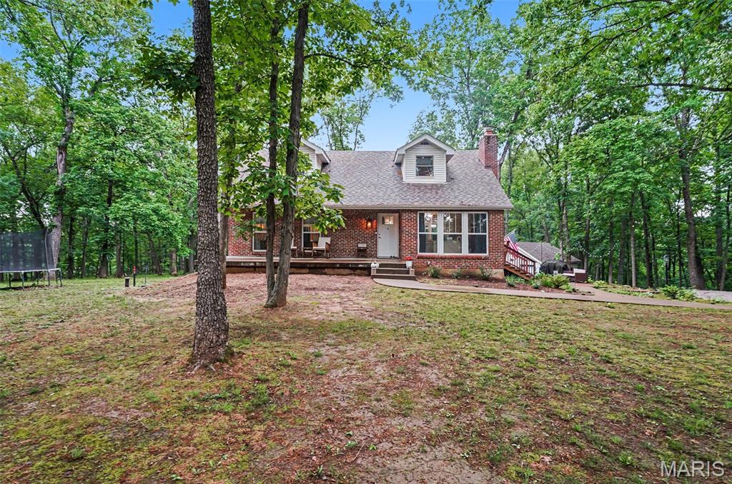 Nestled on 5.8 picturesque flat acres in Hillsboro, this beautifully updated home offers the perfect blend of modern comfort and peaceful country living. Surrounded by mature shade trees, the serene property features a covered patio, fire pit, and scenic views in every direction. Inside, the main and upper levels have been thoughtfully renovated throughout. The main-level living room showcases rich hardwood floors and a cozy wood-burning fireplace, creating a warm and inviting gathering space. The stunning kitchen is designed for both everyday living and entertaining, featuring stainless steel appliances, quartz countertops, and a large center island. Just off the kitchen, you’ll find a fully updated bathroom,  and the primary bedroom, complete with a private full bath and shower with the convenience of laundry hookups.
Step from the eat-in kitchen into the gorgeous four-season room, surrounded by windows that perfectly frame the beauty of the property year-round. Upstairs offers three spacious bedrooms along with a large bathroom with tile floors featuring a classic clawfoot tub and separate shower. The bedrooms all have hardwood floors. 
The lower level also includes a half bath and abundant additional space ready for your personal touch.
This rare property combines updated living spaces, timeless charm, and peaceful acreage all in a beautiful Hillsboro. Close to Highway 21, a grocery store, a gas station, and schools.