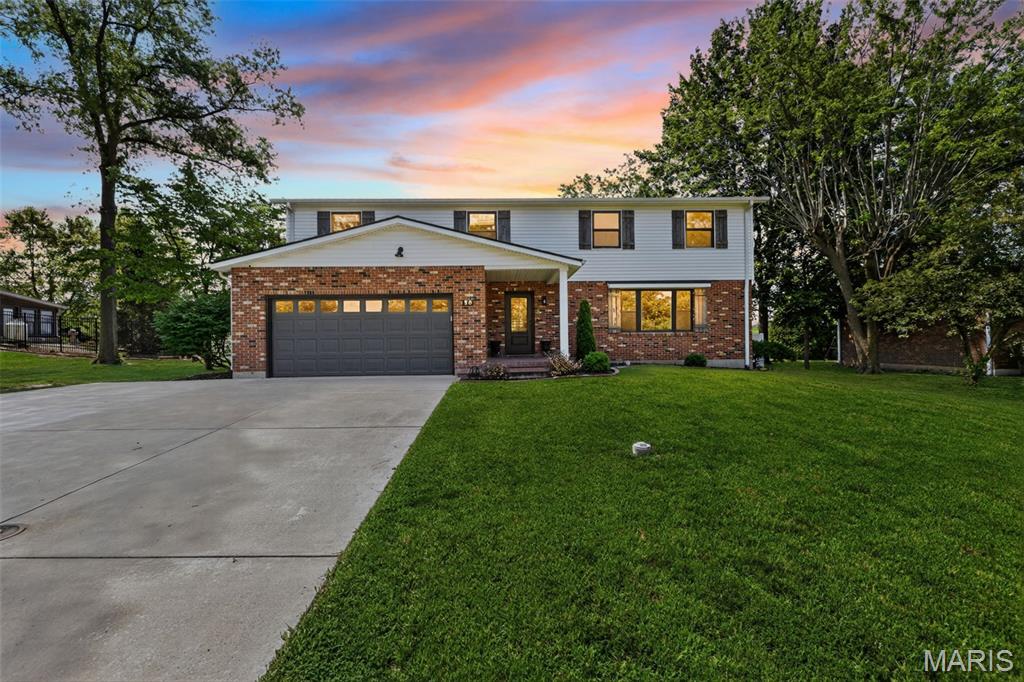 Beautifully fully remodeled 2-story home in a highly desirable neighborhood in Ste Genevieve with great views and convenient access to all amenities. This move-in ready home offers 4 bedrooms, 3 baths, and an open floor plan designed for today's lifestyle. The spacious living area features an impressive open staircase and flows into the stunning kitchen and dining area complete with solid surface countertops, center island, pantry, updated cabinetry, appliances and a family room with fireplace. Luxury flooring extends through much of the home included in the full remodel. Main level features a half bath and large laundry area, with an additional laundry area located in the primary suite. Upstairs offers 4 spacious bedrooms and 2 full baths, including a private primary suite with amazing custom walk-in closet, double vanity, walk-in shower, and laundry. The finished lower level provides a large family room perfect for entertaining, along with additional storage space. Sliding glass doors off the dining area lead to a new patio overlooking the large level backyard with privacy fencing.  Attached 2-car garage and expanded driveway. Major updates include HVAC, water heater, sewer lateral, roofing, windows, gutters, etc and extensive remodeling throughout. A rare opportunity to own a fully updated home with space, style, and functionality priced right to sell. Schedule your private showing soon! (*Complete photos coming soon!)