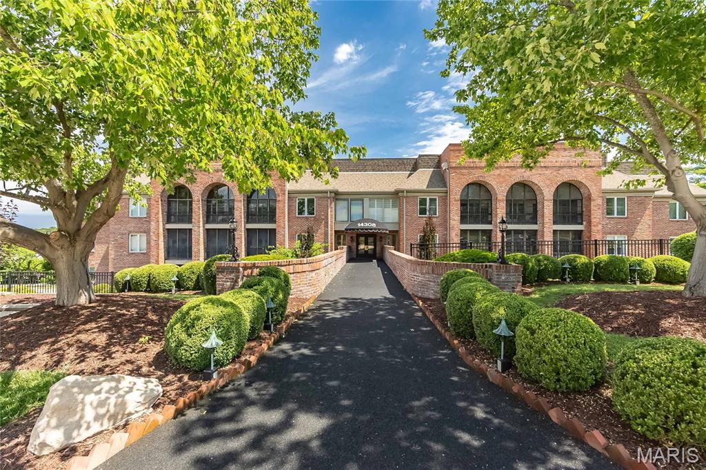 Enjoy easy, low-maintenance living in this spacious 2+ bedroom, 2-bath condo on the main floor, nestled within a gated Chesterfield community. Tucked away from the highway, this desirable location offers a quieter setting than many of the other units, while still being just steps from the clubhouse, pool, and tennis courts.

The versatile floor plan includes a welcoming living room with fireplace, separate dining room, breakfast room, bonus office space, and a bright sunroom that provides valuable additional living space. The generous primary suite features direct access to the sunroom, a walk-in closet plus an additional closet, and a private bath with double vanities, separate tub, and shower.

HVAC - 4 years! Additional conveniences include in-unit laundry, elevator access, an assigned underground garage parking space, with plenty of guest parking in the lot, and exceptional storage with both a large walk-in storage closet near the unit and additional storage in the garage. Conveniently located near shopping, dining, parks, and major highways, this condo offers comfort, convenience, security, and the opportunity to make it your own. Rare combination of a quiet location, abundant storage, elevator access, and resort-style amenities in the heart of Chesterfield.