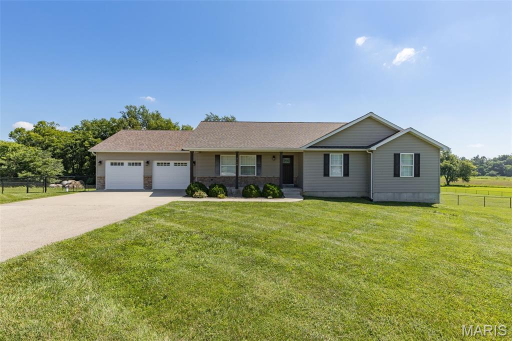 Beautiful Country Home in Great Location Close to Town! 3 Beds, 3 Baths on 3 Acres in a Quiet Subdivision! Nice Open Floorplan with Vaulted Ceilings & Kitchen Island. Basement is Partially Finished with Family Room Area, Full Bath, Storage & Office Space. Backyard is Fenced with a Wet Weather Creek across the Back of the Property and an Equipment Shed with Lean-To. If You're Looking for a Great Location Close to Town- This Is It!