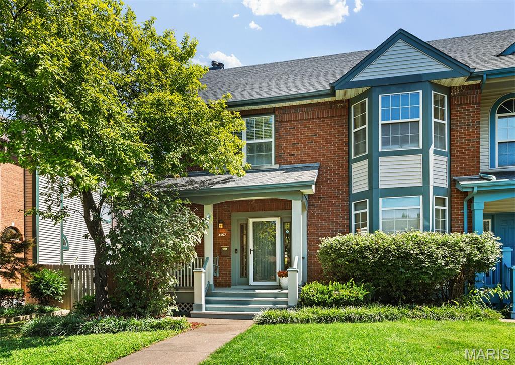 Welcome home to this move-in ready Central West End townhome, delivering an impressive 3 bedrooms, 2.5 bathrooms, and over 2,500 square feet of total living space! The main floor features a welcoming foyer, a separate dining room with a bright bay window, and a spacious living room centered around a cozy wood-burning fireplace. The flow continues into a bright eat-in kitchen, a convenient main-floor laundry room, and an attached two-car garage with plenty of room for large vehicles. Upstairs, brand new carpeting spans the entire level. The expansive primary suite easily fits a California King bed and boasts a walk-in closet and a spa-like en-suite bath with dual vanities, a walk-in shower, and a soaking tub. Two additional large bedrooms, including one with a charming bay window, share a full hall bath. The finished basement adds over 800 square feet of flexible space, perfect for a media room, home gym, or office, plus a separate bonus room and ample storage. Outside, the back deck is built for weekend grilling, overlooking a large, flat, fully fenced yard ideal for pets and play. Located on a peaceful street with a traffic-calming roundabout, commuting is effortless with quick access to Highway 64 and Interstate 44. Best of all, you are just a short stroll from Forest Park, Barnes-Jewish Hospital, SLU, Cortex, City Foundry STL, and the neighborhood's best dining and shopping!