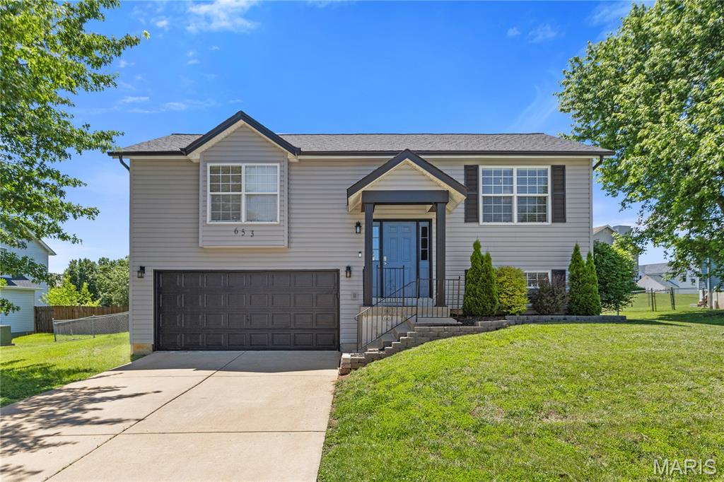 Well-maintained and move-in ready, this 3-bedroom, 2-bath home offers plenty of finished living space and a long list of recent updates. The bright living room features a beamed ceiling and large picture window that fills the space with natural light. The kitchen and breakfast area include two-tone cabinets, stainless steel appliances, a pantry, luxury vinyl plank flooring, and a sliding glass door leading to the deck. All stainless appliances stay, including a Bosch dishwasher and newer microwave.

The main floor offers a spacious primary bedroom with a walk-in closet, a second bedroom, and a full bath. Downstairs you'll find a comfortable family room, third bedroom, laundry area, and access to the oversized two-car garage.

Recent improvements include a brand-new roof with a transferable lifetime warranty, new deck boards with fresh stain, new bedroom windows, new sliding door, new retaining wall, new siding, gutters, exterior paint, exterior lighting, and fresh interior paint throughout. The carpets have also been professionally cleaned, making this home truly move-in ready.

Outside, the fully fenced backyard provides plenty of room for pets, play, gardening, or entertaining. Conveniently located near shopping, restaurants, parks, schools, and major highways, this home is ready for its next owner.