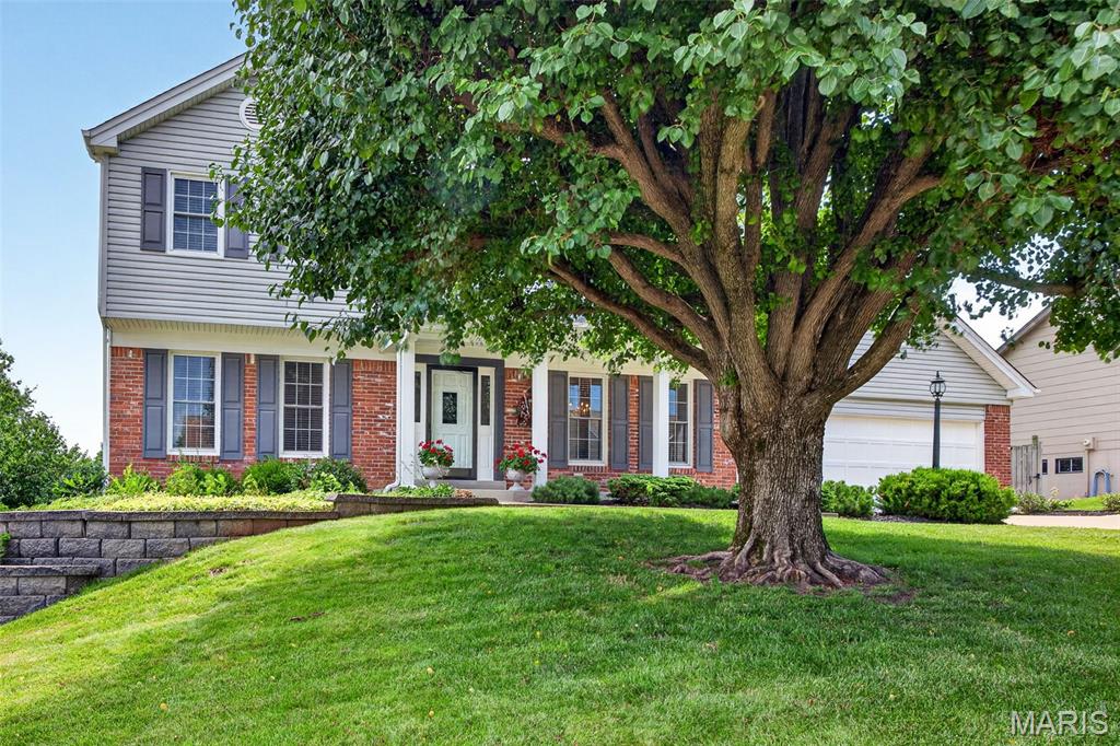 Beautiful curb appeal, stately elevation 2 story 4 bedroom home in wonderful location.  Just minutes from shopping, dining, parks and more.  This traditional floor plan allows for a home office or living room, plus a dining room perfect for gathering.  A generous sized family room with wall of windows, built in bookcases, custom wainscotting and cozy wood burning fireplace.  Butlers pantry offers a coffee bar / beverage center off of the kitchen -a fantastic place for entertaining.  The kitchen features granite countertops, stainless appliances, center island and more.  Step out from the breakfast area to an updated composite "Grilling" deck.  More features like a main level mud room laundry gives you plenty of space to get organized.  The expanded floor plan offers a well sized primary bedroom with gleaming wood floors, pocket door, full bath - whirlpool tub and separate shower, dual sinks and walk in closet.  Bedroom 2 with walk in closet plus bedrooms 3 & 4 with ceiling fans and great window placement for furniture.  The finished walk out lower level adds even more living space with a rec room, family room area, kitchenette (small stove, micro, refrig) and a 1/2 bath ~ this could be an in-laws quarters, home school area or a teen hang out area.  Workshop area for crafts or the handy person of the home. Walk out to the patio and level, nicely landscaped fenced yard.   Updates include composite deck 2026, primary bath toilet 2026, vinyl siding 2011, driveway 2013, windows 2017, roof shingles 2015 - 30 year shingles, hardwood flooring 2004, granite countertops 2010, lower level kitchen flooring 2013, front planter 2008, planter wall in back 2012 so much more.
