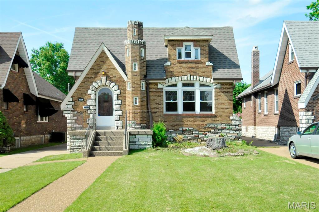 Welcome to this charming Tudor-style (gingerbread) home, thoughtfully designed and built by George C. Karr in 1931, nestled in the highly desirable Lindenwood Park neighborhood of South St. Louis. Rich in architectural character, this timeless residence offers a rare opportunity to own a beautifully crafted piece of St. Louis history.

Inside, you'll find a spacious living room flowing into the dining room, two main-level bedrooms, a large upper-level bedroom offering flexible living space, and a bright, climate-controlled bonus room with skylights that fill the space with natural light year-round. The walk-out basement features a full bathroom and additional living space, ideal for a recreation room, home office, workout space, or other flexible uses.

A standout feature is the oversized two-car garage with dual garage doors, providing convenient access from both the driveway and the alley. The long driveway offers ample off-street parking, while the elevated rear deck provides the perfect place to relax or entertain. 

Enjoy the best of South City living with Lindenwood park, Francis Park, Ted Drewes, The Hill's renowned restaurants, local shopping, and convenient access to I-44 and I-64 all just minutes away. 

Brand new roof and 200 amp electrical service. Priced well below comparable homes in the area. Home is being sold AS-IS.