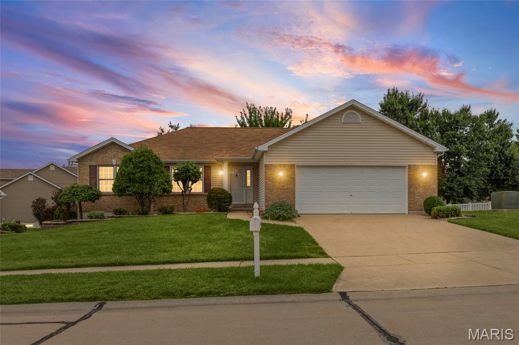 Meticulously maintained home in highly sought-after subdivision! Tucked within a picturesque and peaceful neighborhood (WITH SIDEWALKS I MIGHT ADD), this one-owner home has been lovingly cared for from the very beginning. As you pull into the drive, the pride of ownership is immediately apparent. This ranch-style home offers all the conveniences buyers love, including main-floor laundry and a mudroom located just off the attached garage + a main-floor primary suite that features an ensuite bath and walk-in closet, creating a comfortable and functional retreat. At the heart of the home is the spacious, open living area, anchored by a cozy gas fireplace, soaring ceilings, and an abundance of natural light. The eat-in kitchen offers generous cabinet space and plenty of room for you and your honey to whip up your favorite summer meals together PLUS a movable center island. Step out onto the deck and enjoy a quiet summer evening overlooking the lush backyard. The basement has roughed in plumbing to add another bathroom + living space to your liking. Conveniently located near parks, shopping, and all that the booming area has to offer, this well-loved home is ready for its next chapter! Enjoy peace of mind with the newer HVAC.