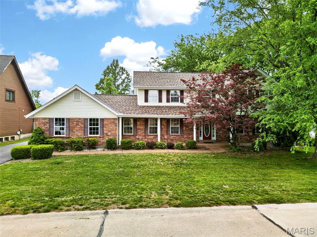 Updated Home in Heritage!!! Let's get excited about this gorgeous large home ready for you! The main level is graced with hardwood floors in the entry and great room, with a fireplace in the great room and crown molding.  There is a wine and coffee wet bar in between the kitchen and the great room for your enjoyment!  The large kitchen features Granite Countertops, a wall oven and microwave built-in, a large center island with smooth top stove, lots of craftsman style beautiful wood cabinets, and there's a large eat-in dining area, plus a formal dining room too.  The main floor laundry is large and has natural lighting.  Oversize rear-entry garage is almost 24 ft. x 21 ft. and there are tons of parking spaces between the long driveway and the rear parking pad area.  Upstairs there are four nice size bedrooms, but don't miss the PRIMARY BEDROOM SUITE WITH A FIREPLACE and sitting area for your personal retreat, and a Hollywood-style bathroom with raised shower and tub area, double bowl oversize vanity and a nice closet.  Huge Updates Include:  New HVAC in 2025.  New Roof and Gutters in 2026.  New Carpet and Pad in 2026 throughout the carpeted areas of the home.  Partially finished lower level includes a recreation room, a full bathroom with a walk-in shower and a large closet, a nice size family room area, plus a huge storage room.  Checkout the attached floor plans with room measurements and info.  Make this one your new place to call home today!  Showings begin Friday, May 15, 2026.