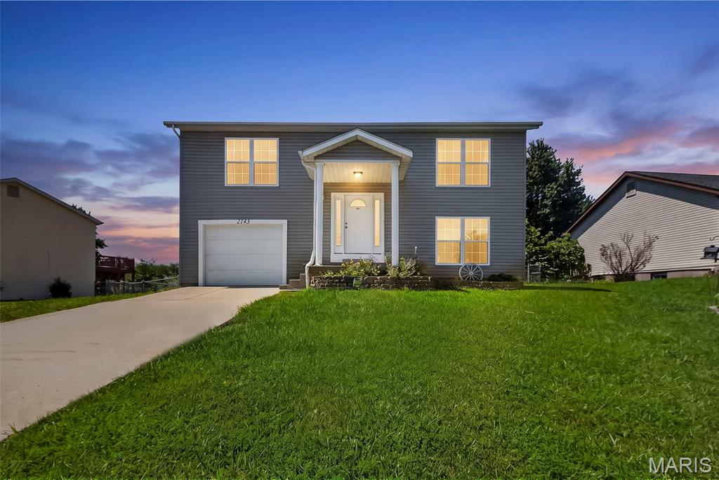 This charming split-level home offers 4 spacious bedrooms and 2 full bathrooms, providing plenty of room for comfortable living.

The bright, open kitchen features beautiful 42-inch maple cabinets, generous counter space, and flows seamlessly into the inviting family room—perfect for entertaining family and friends. Large windows in both the breakfast area and family room fill the home with an abundance of natural light.
The main level includes two well-sized bedrooms and a full bathroom. Downstairs, you'll find two additional bedrooms, a second full bathroom, a large hallway closet, and a convenient laundry room with direct access to the attached garage.  Step outside to enjoy the large, level, fenced backyard—ideal for children, pets, gardening, or outdoor gatherings.  Recent updates include freshly cleaned carpets, fresh interior paint throughout, and a new A/C housing unit, making this home move-in ready.

Don't miss your opportunity to make this wonderful home yours—it won't last long!