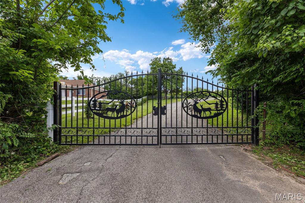Rare opportunity to own approximately 2.5 gated acres with stunning bluff views and unlimited potential. Live on the property while you build your dream home, create a hobby farm, or explore commercial opportunities. Previously zoned commercial with an estimated 15,000 cars per day passing by, this property features a 16-stall horse barn, additional loafer barn, and a large workshop, making it ideal for equestrian use, storage, business operations, or future development.
Major updates have already been completed, including: 
* All new plumbing
* Updated kitchen and bathroom
* New septic system rated for 6 bedrooms
* New roof
* Water filtration system
* New sump pump
* New sliding
* New windows
* New flooring
Whether you are looking for a private estate setting, investment opportunity, business location, or a place to build your forever home, the possibilities here are truly endless.  Must see to image the possibilities
This property is located near shopping, restaurants with great opportunities for development
Lots of updates though-out and the sliding barn-style doors add a great touch
Property is being sold as-is.
