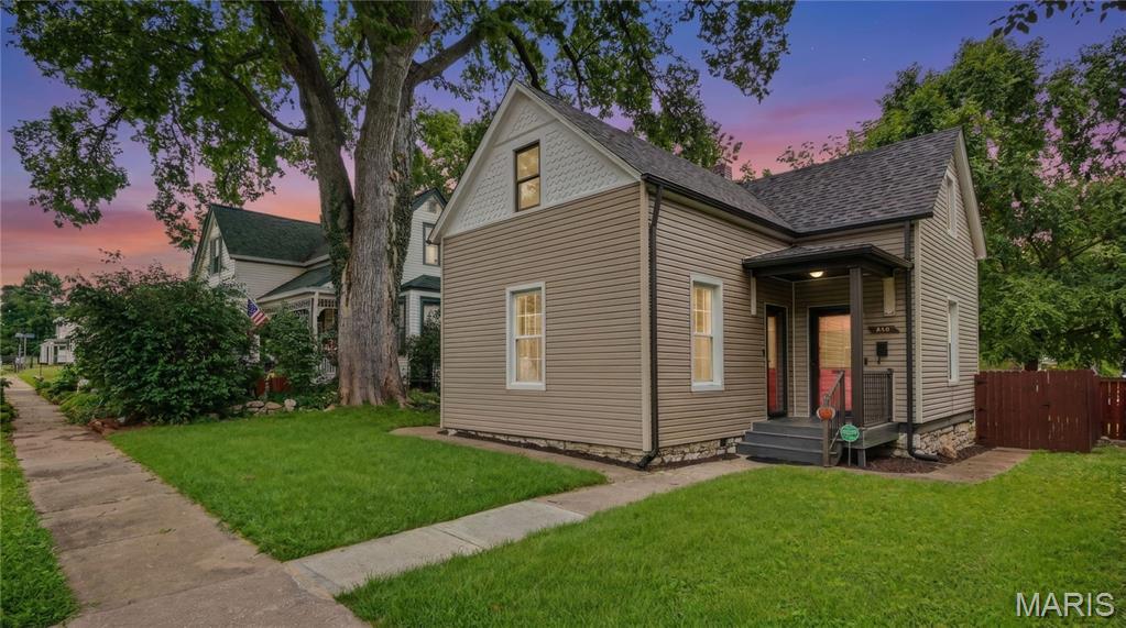 Welcome home to 318 N. Benton Avenue, a charming 3-bedroom, 2-bath, 1.5-story home that's full of character and ideally located in the heart of St. Charles.

This home offers the best of both worlds—classic architectural charm combined with stylish updates that make it comfortable for today's lifestyle. You’ll absolutely fall in love with this one straight from the curb! Inside, you'll find beautiful original woodwork, tall ceilings, crown molding, 10” baseboards, transom windows, and plenty of natural light that give the home a warm, inviting feel. The updated kitchen features white cabinetry, modern finishes, and plenty of cabinet and counter space, making it both functional and a great place to gather. Gorgeous LVP floors throughout the main level and luxurious ceramic tile throughout the upper floor!

The main level includes a spacious primary bedroom with ensuite, while upstairs you'll find two additional bedrooms, another full bath, and a flexible bonus space that's perfect for a home office, playroom, or reading nook. Another unique feature of this home is that a new buyer could opt to use the upper level as a complete primary suite if they so desired.  
Step outside to enjoy the fenced backyard with a private patio that's ready for relaxing, entertaining, or summer cookouts. There's also a huge, oversized, detached garage with extra storage and additional off-street parking, and boasting a 9’ overhead door!
HVAC and water heater were installed in 2019 and a new roof in 2023! Refrigerator, washer & dryer are included with the sale! Did I mention there's a main floor laundry?!
NOTE: The main level primary en suite was a separate rental unit with private entrance at one time, which is why it has it's own sink, stove and mini fridge. These can be removed and utilities capped if buyer prefers.

Location is where this home truly shines. Enjoy all that historic St. Charles has to offer with Historic Main Street just a 9-minute walk (or a quick 2-minute drive) away, where you'll find charming boutiques, award-winning restaurants, coffee shops, festivals, and riverfront entertainment. Outdoor enthusiasts will love being only a 3-minute bike ride from the Katy Trail, offering miles of scenic biking, walking, and running along one of Missouri's most treasured recreational trails. Close proximity to HWYs 70 & 370, Lindenwood University, Ameristar Casino, Streets of St Charles and so much more!
If you've been searching for a home filled with character, modern updates, and an unbeatable location, this historic St. Charles gem is THE one you won't want to miss!
