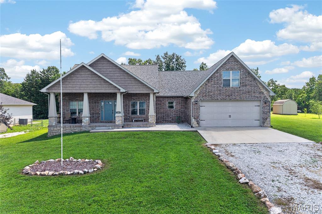 WOW! This beautiful 3 bedroom, 2 bathroom home offers a spacious layout with a large upstairs bonus room that could easily serve as a 4th bedroom, home office, or playroom. A welcoming covered front porch leads you inside to an open floor plan featuring vaulted ceilings, a bright living room, an eat-in kitchen, and a separate dining area. The kitchen is designed for both everyday living and entertaining, featuring stainless steel appliances, a large center island, and plenty of cabinet space. The split-bedroom floor plan provides added privacy, with two bedrooms and a full bath on one side of the home. The spacious primary suite features tray ceilings, a walk-in closet, and a private bathroom with double vanities, a jetted tub, and a separate shower. Just off the primary suite, you'll also find the laundry room and barn door access to the upstairs bonus room. Outside, you'll love the mostly level lot, fenced backyard, and extended covered deck, perfect for relaxing or entertaining. This home checks all the boxes and is ready for its next owners. Schedule your showing today!