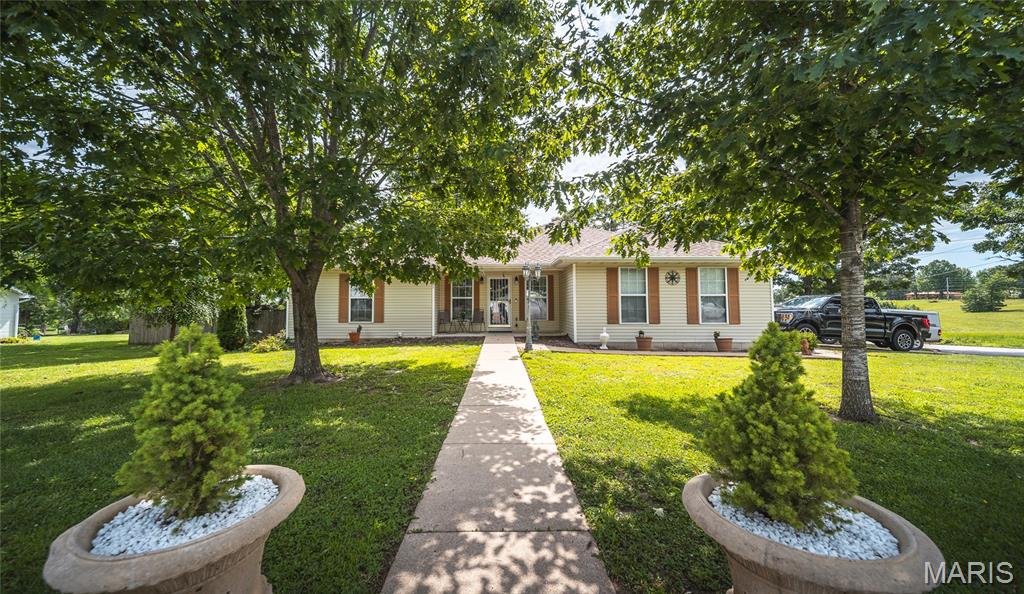 Located next to the golf course in Dixon, this beautifully maintained 3-bedroom, 2-bath home offers the perfect combination of comfort, convenience, and outdoor enjoyment. With a peaceful setting and thoughtful updates throughout, this property is ideal for anyone seeking a move-in ready home with plenty of space both inside and out. Step inside and discover a bright, welcoming interior featuring durable luxury vinyl plank flooring and a layout designed for everyday living. The heart of the home is the impressive kitchen, where abundant cabinet space, stunning quartz countertops, and generous work areas make meal preparation and entertaining a pleasure. Whether you're hosting holiday gatherings or enjoying a quiet dinner at home, this kitchen is sure to become a favorite gathering place. The home offers three spacious bedrooms, providing comfortable accommodations for family, guests, or a home office. Pride of ownership is evident throughout, and the HVAC system replacement in 2023 adds valuable peace of mind for years to come. Outside, you'll fall in love with the huge fenced backyard. Mature trees provide shade and privacy, creating the perfect environment for relaxing, entertaining, gardening, or letting pets play freely. A storage shed offers additional space for tools and equipment, while the 20-foot flagpole in the front yard adds a touch of character and curb appeal. If you've been searching for a well-cared-for home in a desirable location near the golf course, this Dixon gem is a must-see. Schedule your private showing today and experience everything this property has to offer!