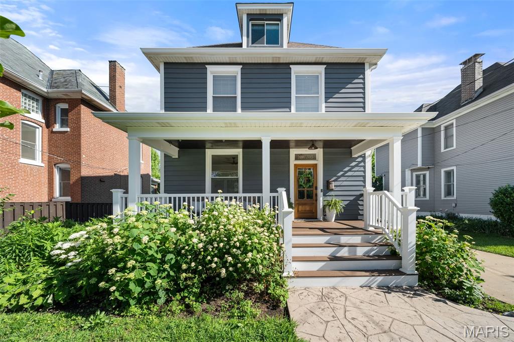 Long admired by passersby strolling to and from Maplewood’s beloved coffee shops, restaurants, boutiques, and community traditions like Taste of Maplewood, this Marietta Avenue home has become one of those houses people instantly recognize and always remember. With its welcoming front porch, impressive curb appeal, storybook gardens, and unmistakable charm, it naturally draws attention in every season.

Inside, historic character and thoughtful updates exist in perfect balance. A massive pocket door, beautiful wood staircase, rich millwork, and an elegant dining room speak to the home’s timeless craftsmanship, while carefully considered improvements bring comfort and ease to everyday living. The second floor offers a true primary suite complete with an en suite bathroom, along with two additional bedrooms, convenient second-floor laundry, and an additional full bathroom in the hall. Upstairs, the finished third level creates a comfortable and versatile space with views stretching both over the lush backyard gardens and toward the vibrant energy of downtown Maplewood.

And then there is the garden itself, woven so intentionally into the experience of the home that it feels less like landscaping and more like a living extension of the property’s soul. Native blooms, edible plantings, flowering trees, and thoughtfully layered greenery create a space alive with movement, color, and purpose throughout the seasons. Recognized as a Bring Conservation Home Gold Star-certified garden, the landscape is both beautiful and deeply rooted in sustainability, offering moments of quiet beauty, connection, and abundance at every turn.

More than just a beautifully preserved historic home, 7316 Marietta is a place that feels deeply rooted in both community and nature. From mornings spent on the front porch watching the neighborhood come to life, to evenings surrounded by the quiet beauty of the gardens, every space invites you to slow down and stay awhile. With a presence that has quietly become part of the fabric of the neighborhood, this is a home filled with character, intention, and a story that continues to unfold with each passing season.