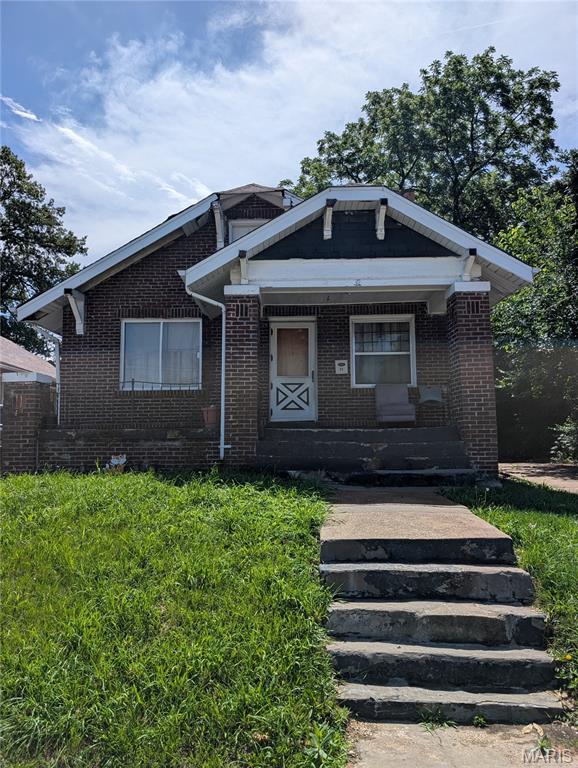 Investor Special! Don’t miss this fantastic opportunity to own a classic full-brick bungalow in one of St. Louis’s highly sought-after neighborhoods. Known for its timeless curb appeal and durable construction, this charming home offers endless potential for renovation or customization. Featuring a functional 2-bedroom, 1-bath floor plan, a full basement with abundant storage space, and ample off-street parking, this property is the perfect canvas for your vision. Being sold AS-IS, this is an ideal opportunity for investors, rehabbers, or buyers looking to create their dream home while adding value. Conveniently located near local amenities, shopping, dining, and major highways. Schedule your showing today and explore the possibilities!