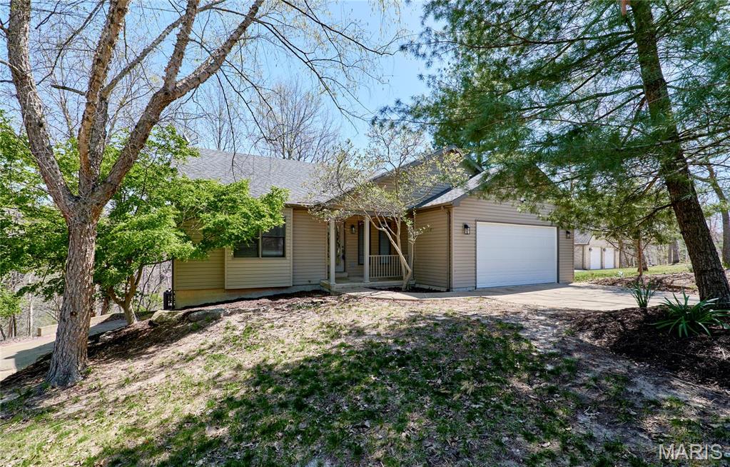 You will love this beautifully updated/remodeled Ranch, attached to the main lake at the bay. Vaulted ceilings, gas fireplace, in living room & cozy hearth room. Spacious master bedroom suite with walk in closet and Lenin closet. Separate Jacuzzi Jet Tub and shower, his & hers vanity with ceramic tile flooring. Kitchen is upgraded with ceramic tiles, newer stainless-steel appliances. Custom cabinets with pull-outs & lazy Susan, granite countertops, breakfast bar & pantry. Large main floor laundry with wash basin. New hardwood flooring in entry hallway, living & dining room New lighting & plumbing fixtures, updated hall bathroom with ceramic tile flooring and new fixtures. Finished walkout lower-level features full kitchenette / bar with cabinets, breakfast counter, sink, stove, and room for full size fridge. Large family room with Pergo laminate flooring, 2 bedrooms & full bath. Large covered wrap-around deck, off family/rec room is great for summer entertainment & overlooks the large lot. There is  concrete pad that can be attached to wooden dock that is at the end of the bay on the main lake. Storage shed close to the lake for storing fishing equipment , etc. Total of 3 car garage, 2 on the main entry and one tuck under boat/car garage with separate driveway. There are plenty of closets & storage in this home. Nestled across the cove from the Clubhouse, Beach, & Pool area. Great location at the Lake Sherwood.