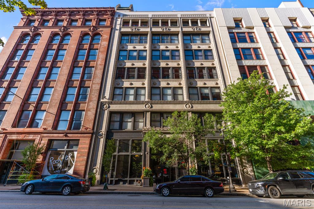 Urban Loft Living at 1015 Washington Ave., Unit 501
2 Bedrooms | 2 Bathrooms | 1,317 Sq. Ft.

Experience the perfect blend of historic charm and contemporary style in this beautifully updated downtown loft, ideally situated at the highly sought after corner of 11th Street and Washington Avenue.

This move in ready residence offers an impressive list of upgrades, including updated lighting, modern kitchen and bathroom finishes, enhanced closet systems, newer appliances, a brand new garbage disposal, and a thoughtfully designed layout that combines comfort with functionality.

Inside, you'll find soaring timber ceilings, exposed brick walls, oversized windows that flood the space with natural light, and an open floor plan that captures the true essence of urban loft living.

The stylish kitchen is designed for both everyday living and entertaining, featuring granite countertops, upgraded cabinetry, a bar height island, a built in drawer microwave with push button open and close, black stainless steel appliances, and a brand new garbage disposal. An in unit washer and electric dryer add everyday convenience.

The spacious primary suite offers a walk in closet and a beautifully updated ensuite bathroom with a double sink vanity, deep soaking tub, separate shower, and a newly installed toilet with decorative shelving above.

Both bedrooms feature modern barn doors that enhance the loft's industrial character while maximizing usable space. Ceiling fans throughout provide added comfort year round.

Building Amenities Include:
• Secure climate controlled garage with one assigned parking space
• Private storage locker on the second floor
• Rooftop patio with breathtaking downtown skyline views
• Fitness center
• Secure building access

Seller Incentives: Seller is offering 6 months of paid HOA fees plus $1,000 toward the buyer's closing costs with an accepted offer by August 15, 2026.

Located just steps from Ballpark Village, Busch Stadium, CityPark, award winning restaurants, entertainment, shopping, and MetroLink, this exceptional loft offers the best of downtown St. Louis living.

Historic character. Modern updates. Prime location. Welcome home to 1015 Washington Avenue, Unit 501.