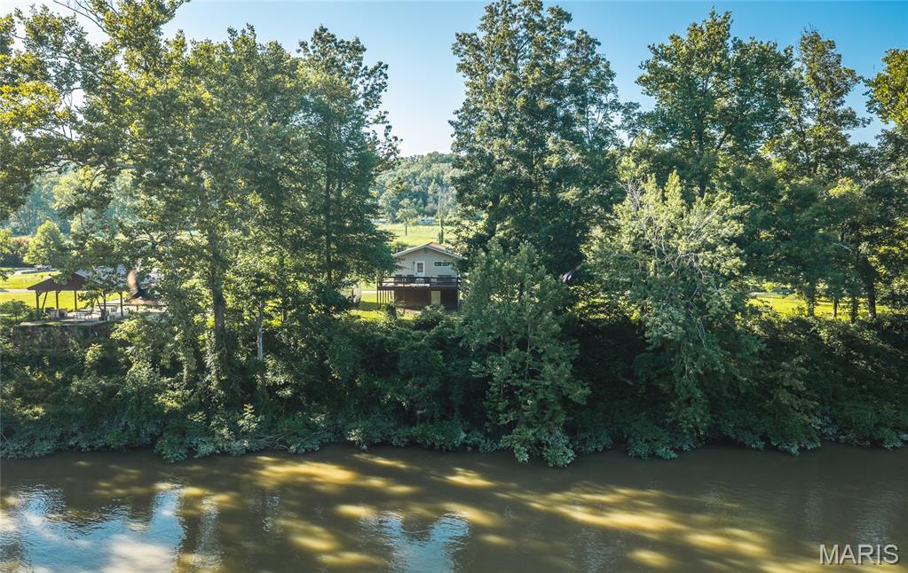 Escape to the peaceful beauty of the Gasconade River with this charming 2-bedroom, 1-bath riverfront cabin that's ready for your next adventure. Whether you're searching for a relaxing weekend getaway, a full-time retreat, or an investment opportunity, this well-maintained property offers the perfect blend of comfort, nature, and endless potential.

Wake up to the sights and sounds of the river, spend your afternoons fishing, kayaking, floating, or simply unwinding on the bank as the water flows by. This inviting cabin has been lovingly cared for, allowing you to spend more time making memories and less time worrying about maintenance.

What truly sets this property apart is the incredible value of the additional lots included in the sale. With 1 lot next to the cabin and one more behind it, you'll enjoy extra privacy, room to expand, space for outdoor entertaining, or the opportunity to create your own riverfront oasis. Whether you envision adding a garage, extra parking, a firepit gathering area, or simply preserving the open space, the possibilities are endless.

Properties on the sought-after Gasconade River don't come along often—especially ones offering this much flexibility and potential. Don't miss your chance to own a slice of Missouri riverfront paradise. Schedule your private showing today and discover everything this unique property has to offer!