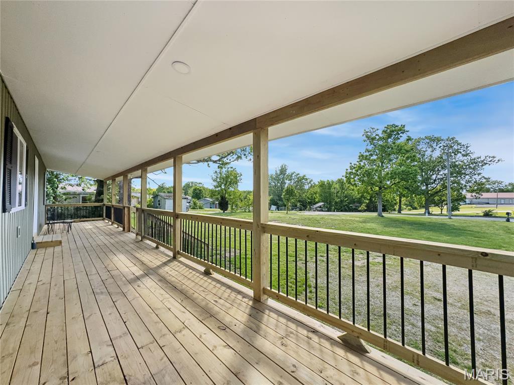 Completely rebuilt from the ground up, this 5-bed, 3-bath home in Camdenton delivers space, flexibility, and a true “nothing left to do” remodel. Everything has been redone—roof, siding, windows, HVAC (with ductwork), flooring, appliances, and more. 
The setup is what makes this one stand out. Two full kitchens, two laundry areas, and a walkout lower level create a natural split for multi-generational living, guests, or even separate living quarters if needed. Upstairs offers a 3-bed, 2-bath layout, while the lower level adds 2 more bedrooms with a Jack-and-Jill bath—giving you true primary suite options on both levels. No stairs required for lower-level access, which is a big plus for long-term usability.
The home sits on a flat, usable 0.54-acre lot inside Camdenton city limits. Plenty of room to add a shop, garage, or just enjoy the space. Covered front porch adds to the curb appeal and gives you a functional outdoor area right out front.
Location checks the boxes too—just minutes to grocery stores, restaurants, schools, and all the Lake of the Ozarks attractions.
If you’ve been looking for a large, fully updated home —and don’t want a project—this is one that delivers real value for the money.
