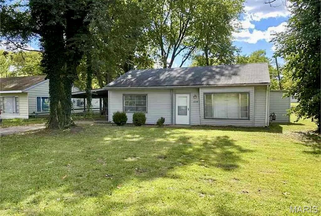 Fantastic investment opportunity with immediate cashflow! This tenant-occupied 2-bedroom, 1-bathroom, 1-story ranch offers an excellent opportunity to add a turnkey rental to your portfolio. Currently leased at $1,155 per month through April 2027, this property provides immediate rental income with a solid tenant already in place. The home features an open living area, 2 generously sized bedrooms, 1 full bathroom w/ a shower/tub combo, a large level lot, covered parking, and the convenience of main floor laundry. Prime location near highway access, parks, schools, shopping, and everyday amenities, this highly rentable property makes an ideal long-term investment. Turnkey, low-maintenance, income-producing, and ready to go from day one. Don't let this opportunity pass you by! No seller financing available.