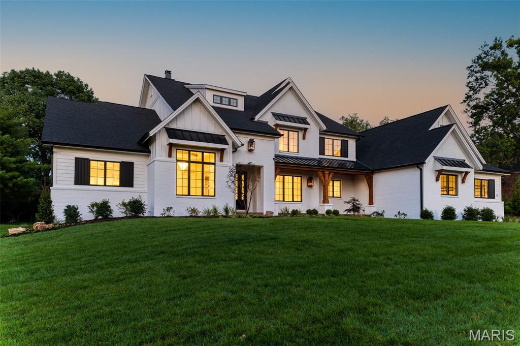 Introducing the Westchester IV at Ballas Ridge by Kemp Signature Homes. Relaxed elegance defines this 1.5-story modern farmhouse, offering over 5,400 sq. ft. on the main level (with optional finished lower level for additional living and entertainment space). Set on estate homesites ranging from 1.6–6.5 acres in Des Peres’ most exclusive new enclave, this residence blends privacy, natural beauty, and luxury. The exterior features painted white brick, timber posts and braces, standing seam metal accents, gas lanterns, a mahogany entry door, and a 4-car side-entry garage. Inside, discover exquisite millwork, job-finish hardwoods, coffered and beam ceilings, solid-core doors, Kohler fixtures, and smart home automation. The expansive floorplan opens with a foyer flanked by study and formal dining with butler’s pantry, leading to the Grand Salon—an impressive space with hearth and wet bar that flows to the chef’s kitchen with deluxe Dacor appliances and custom stainless range hood. An outdoor entertainment room extends the living space. The main-level owner’s wing boasts a designer-ceilinged bedroom, spa-like bath with free-standing tub and multi-spray shower, dual vanities, and dual walk-in closets. Upstairs offers a loft, bonus room, three bedroom suites with walk-in closets, and a second laundry.
Ballas Ridge offers unmatched convenience—minutes to top schools, dining, shopping, hospitals, and highways—paired with the opportunity to build your custom dream home.