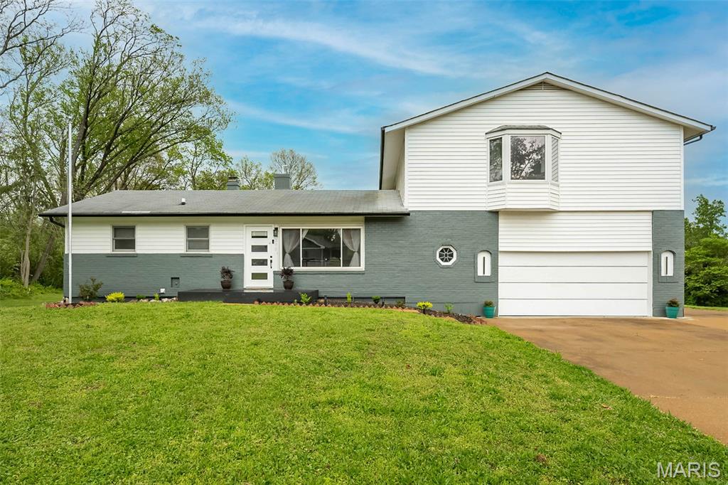Beautifully updated 5 bed, 3.5 bath home in highly sought-after Westridge subdivision, set on nearly .7 acres of level, usable yard and located in the award-winning Parkway School District! This stylish home offers a versatile floor plan with 2 bedrooms conveniently located on the main floor, along with bright, open living spaces and stylish updates throughout. The fully renovated kitchen features sleek quartz countertops, updated cabinetry, and stainless steel appliances, flowing seamlessly into the main living areas with newer flooring, modern lighting, baseboards, doors, and fresh paint. Upstairs, you’ll find 3 additional bedrooms, including an expansive primary suite with impressive space, flexibility, and a delightful bathroom. The updated bathrooms showcase beautiful porcelain tile finishes! The partially finished lower level provides the perfect second living area, rec space, or retreat anchored by a wood-burning fireplace. Enjoy outdoor living on the deck overlooking the large grassy backyard. Storage shed with upper-level loft for added functionality. Additional highlights include main floor utility room, a spacious garage with 3rd parking pad and EV charging station, and newer HVAC! Washer & Dryer included. A rare blend of space, updates, and lot size in an unbeatable location!
