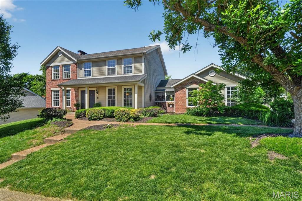 Showings start Thursday 5/21 and Open House Saturday 5/23 1pm-3pm.

Welcome to 15327 Grantley Drive, a beautifully maintained 4-bedroom, 2.5-bath two-story home in a highly desirable Chesterfield location. Set on a lovely lot with mature landscaping, this home offers classic curb appeal, a two-car attached garage, and a welcoming covered front entry with double doors. Inside, a grand foyer sets the tone with an impressive staircase, custom stained glass detail, and a spacious, flowing main-level layout. The first floor features a convenient racetrack-style floor plan where the rooms connect seamlessly, creating an easy flow for everyday living and entertaining. The formal dining room offers generous space for gatherings, while the living and family areas provide multiple places to relax, including a comfortable family room with built-ins, a brick fireplace, and great natural light. The eat-in kitchen offers ample cabinet storage, generous counter space, a center island, stainless steel refrigerator, and a charming breakfast area with access to the deck overlooking the backyard. A main-floor laundry room and half bath add everyday convenience.
Upstairs, all four bedrooms are thoughtfully located on the same level, including a spacious primary suite with a fireplace, large walk-in closet, and an updated en suite bathroom featuring a double vanity, jetted tub, and separate shower. Three additional bedrooms and a second full bathroom complete the upper level. The finished walkout lower level adds nearly 1,000 square feet of additional living space, offering a large recreation area, bar seating, built-ins, flexible sleeping or office space, and ample storage beyond the finished area. Outside, enjoy a large fenced backyard, deck, and walkout access from the lower level, creating excellent indoor-outdoor functionality. Ideally located near Highway 40, Logan University, and just a stone’s throw from the exciting new Chesterfield entertainment district, this well-cared-for home offers space, character, convenience, and a prime Chesterfield setting.