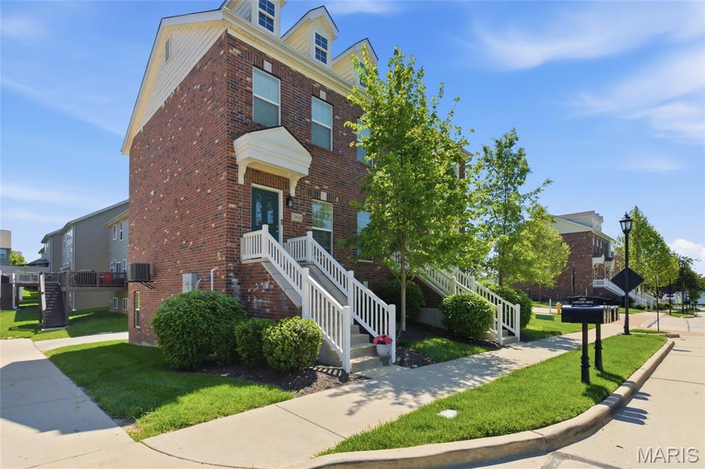 Charming, low-maintenance townhome is move-in ready featuring ten foot ceilings, beautiful custom wood work on multiple accent walls, and new carpet upstairs! Step inside to a spacious family room that flows into an updated eat-in kitchen featuring quartz countertops, GE slate appliances, wood flooring, and custom cabinetry. A convenient main-floor half bath completes the first level. Upstairs you will find two master suites each with its own private bathroom. Laundry is thoughtfully located between the two bedrooms. The lower level includes a versatile mudroom area that can also function as a dedicated home office, ideal for remote work or extra organizational space. A two-car attached garage with a Tesla Electric Vehicle Charger (NACS) and additional storage round out the lower level.

Outdoor enthusiasts will love having the bike path and scenic walking trails just steps from the front door. Walking distance to Wildwood’s Town Center featuring the new Village Green, restaurants, movie theatre  and so much more! Located in the highly sought after Rockwood School District. Agent Owned.