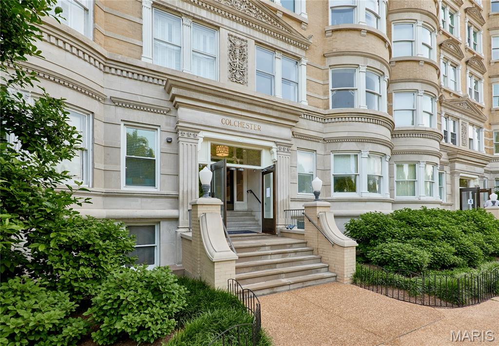 Experience timeless elegance at ABC Condominiums, a historic 1906 building overlooking Forest Park and listed on the National Register of Historic Places. This spacious 2nd-floor condo offers over 2,000 sqft of beautifully updated living space featuring refinished hardwood floors, stunning original millwork, curved glass windows, and an original fireplace. The functional floor plan includes a large formal dining room, updated kitchen with custom cabinetry, generous guest bedroom, and a private primary suite with bonus sunroom/office space. Enjoy breathtaking sunset views from the rooftop deck along with additional amenities including a garden patio, hobby/workshop room, assigned storage, community laundry, and 1 attached garage parking space.
